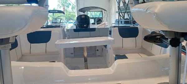 2024 Tahoe 1950 boat interior with seating and table, showcasing modern design and comfort.