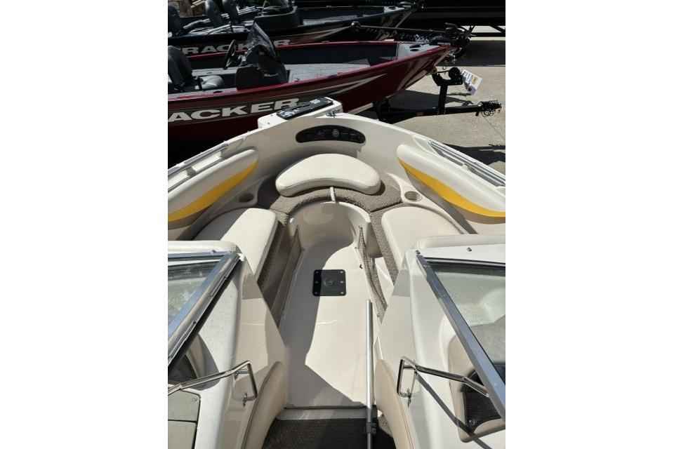 2003 Glastron GX 185 Ski & Fish boat interior with seating and windshield.