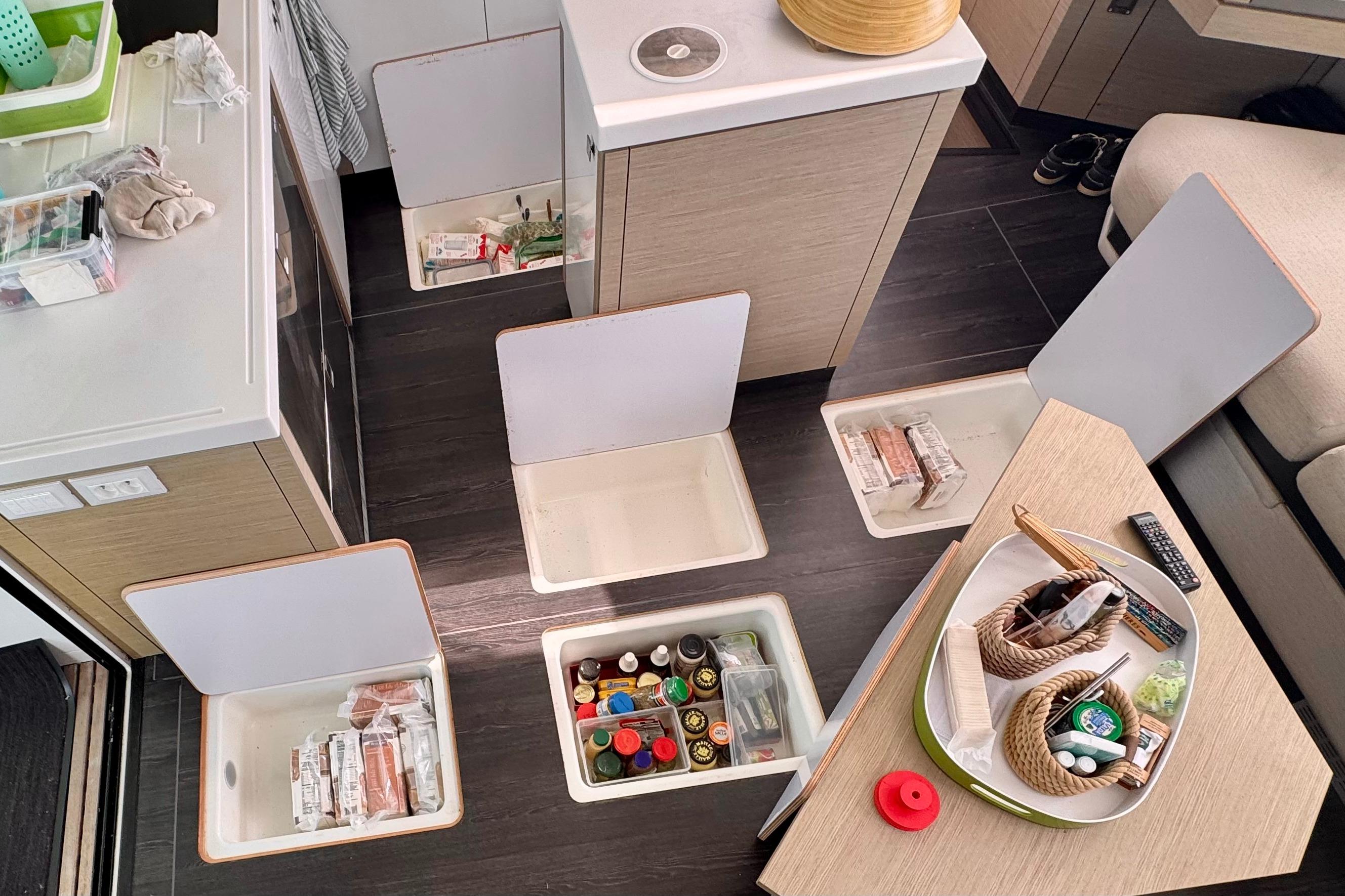 Interior of 2020 Fountaine Pajot Saona 47 with open floor storage compartments.