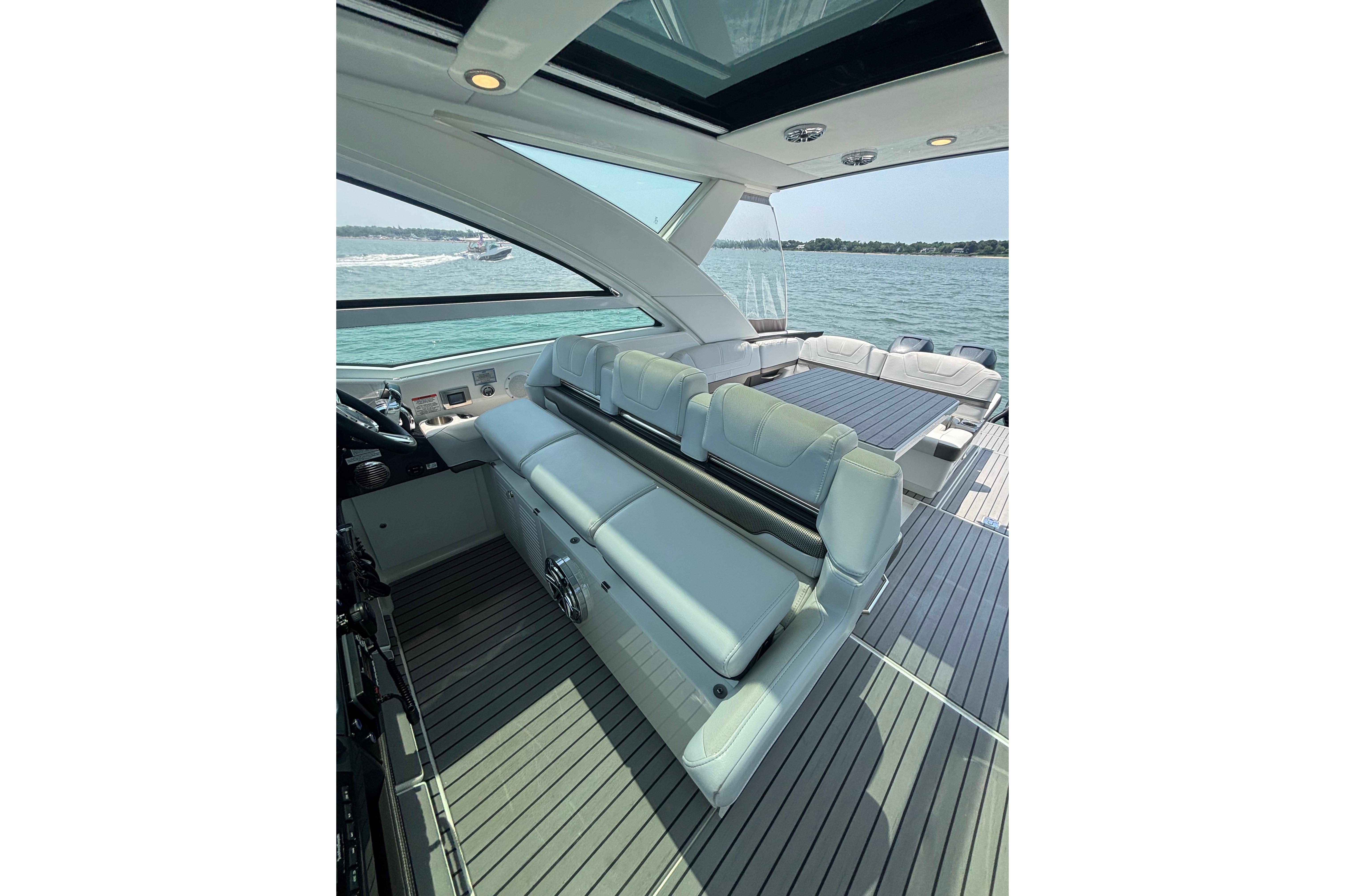 2019 Formula 430 Super Sport Crossover yacht interior with luxurious seating and scenic water view.