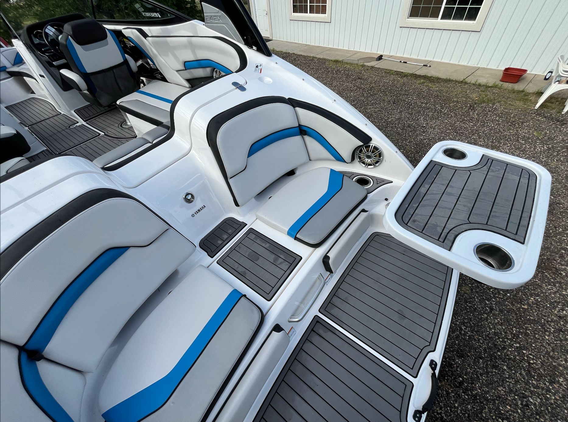 Interior of a 2017 Yamaha 242X E-Series boat with blue accents.