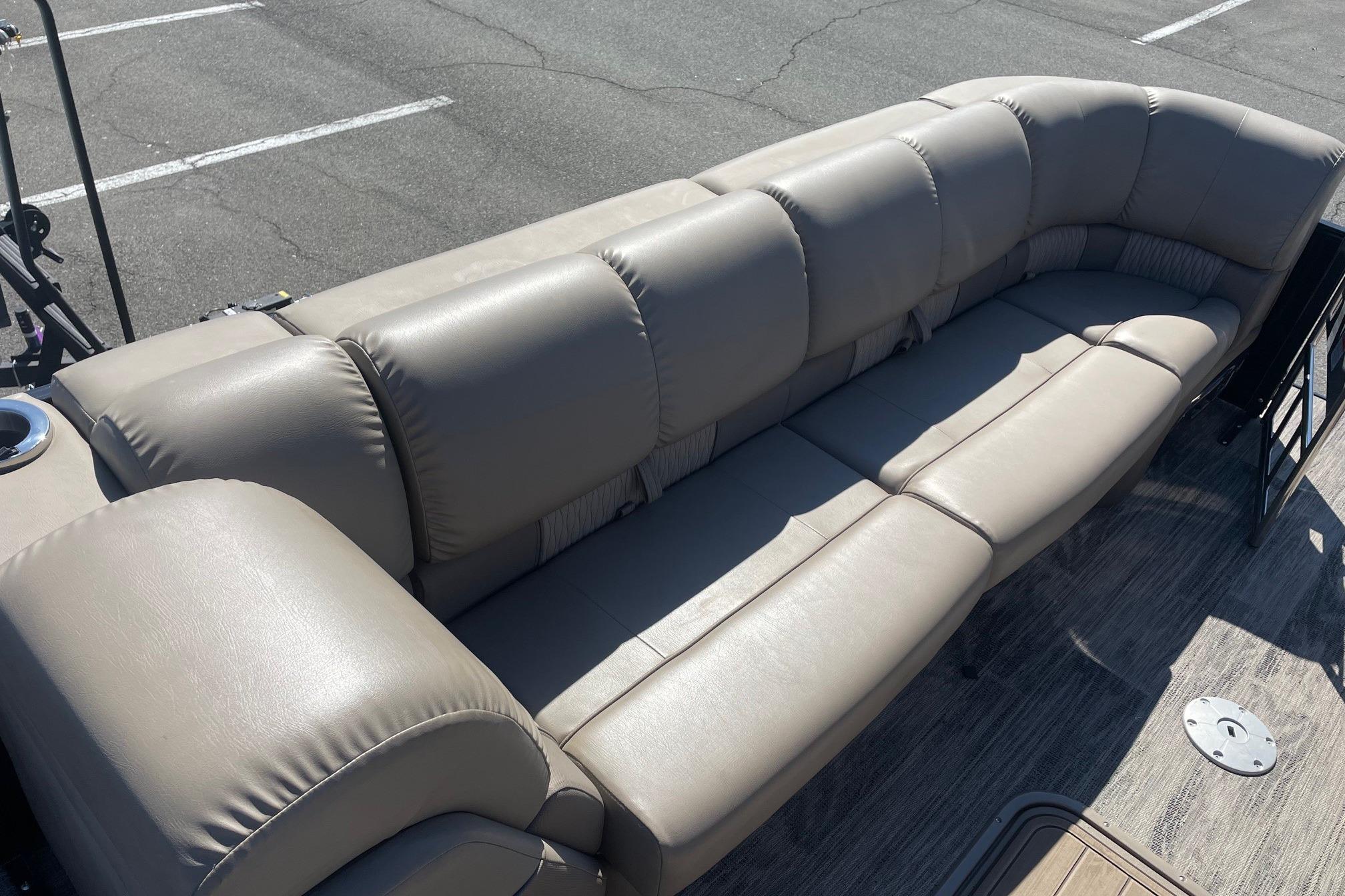 Luxurious seating on 2024 Ranger 2500LS boat, featuring plush beige upholstery.