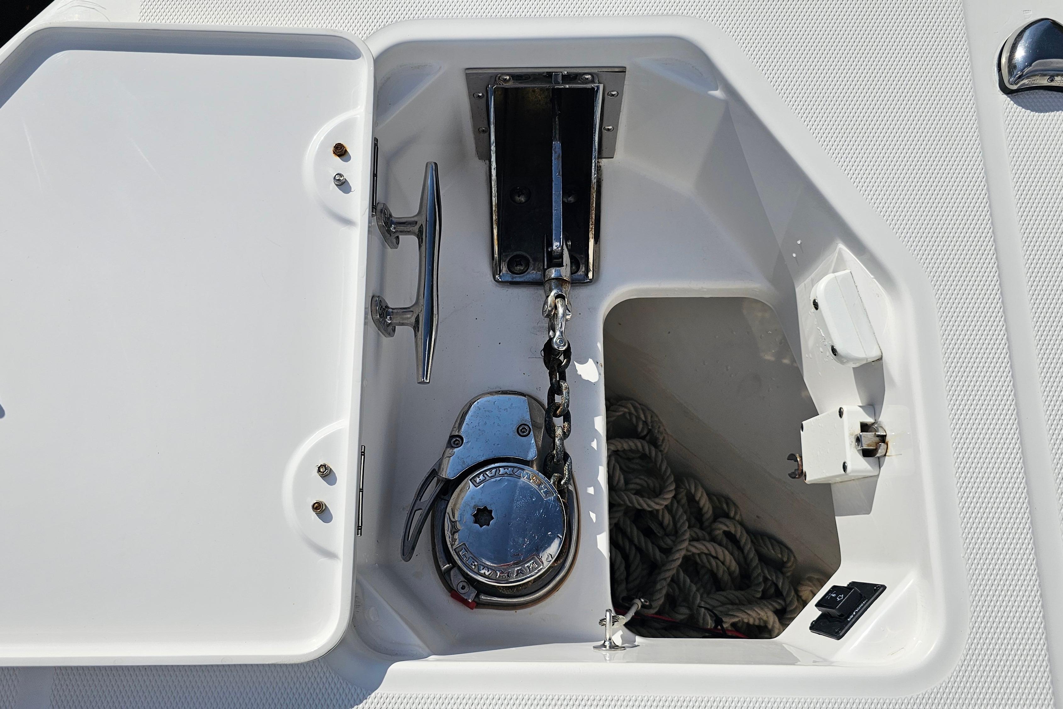 Anchor compartment of 2021 Everglades 273 Center Console boat with rope and winch.