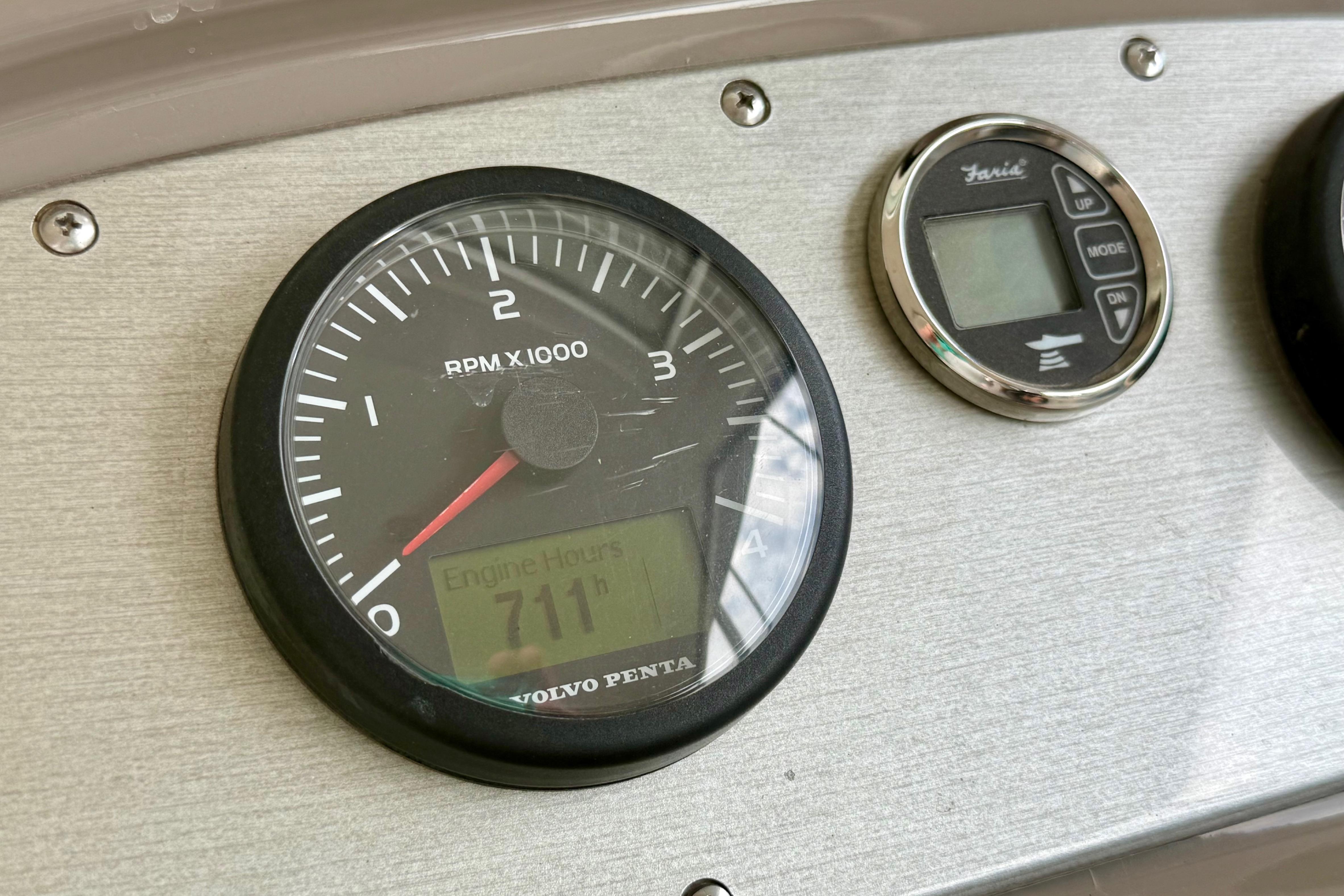 Volvo Penta tachometer and digital gauge on 2011 Cruisers Yachts 390 Sports Coupe dashboard.