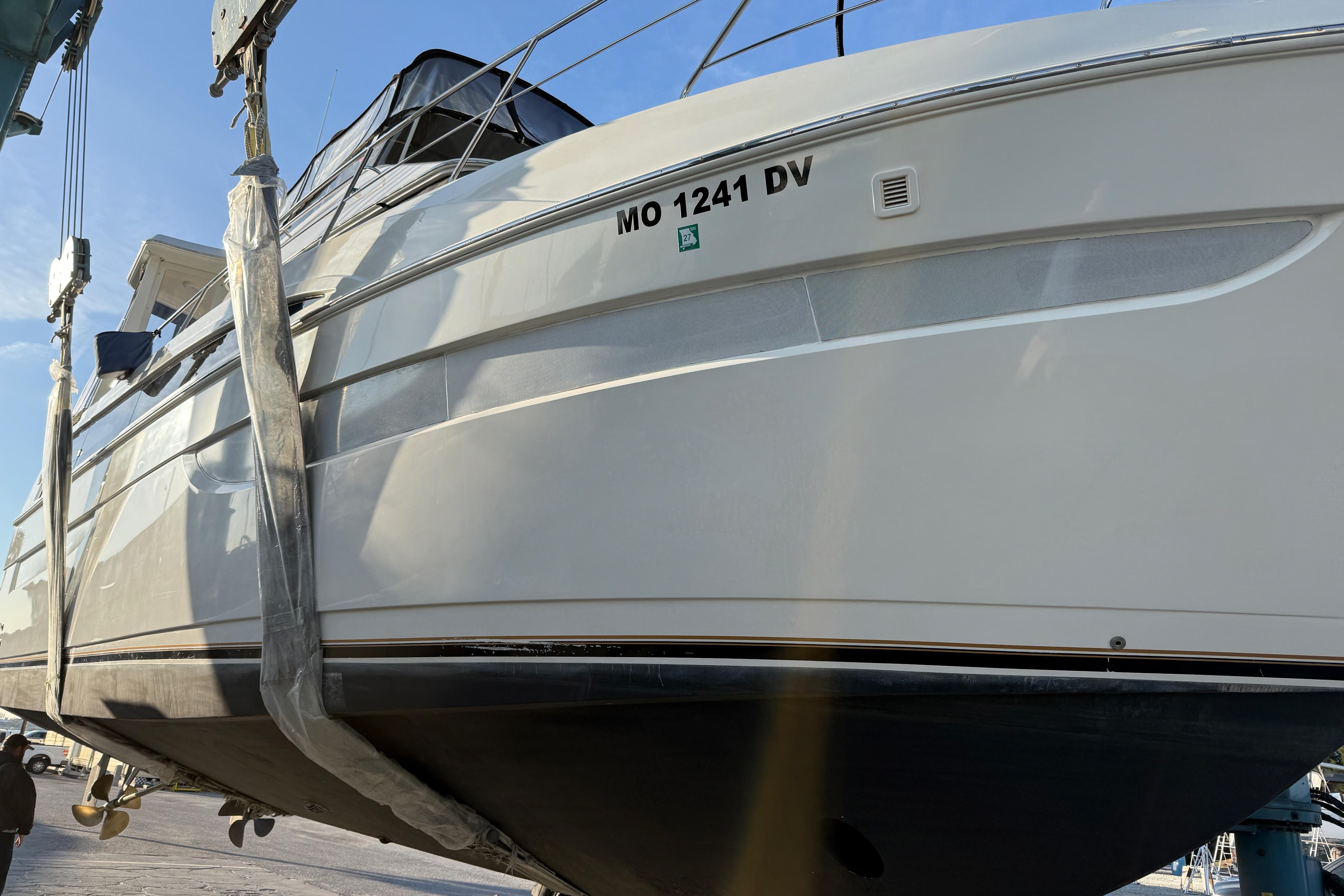 2006 Carver 43 Motor Yacht in dry dock, showcasing sleek design and hull details.
