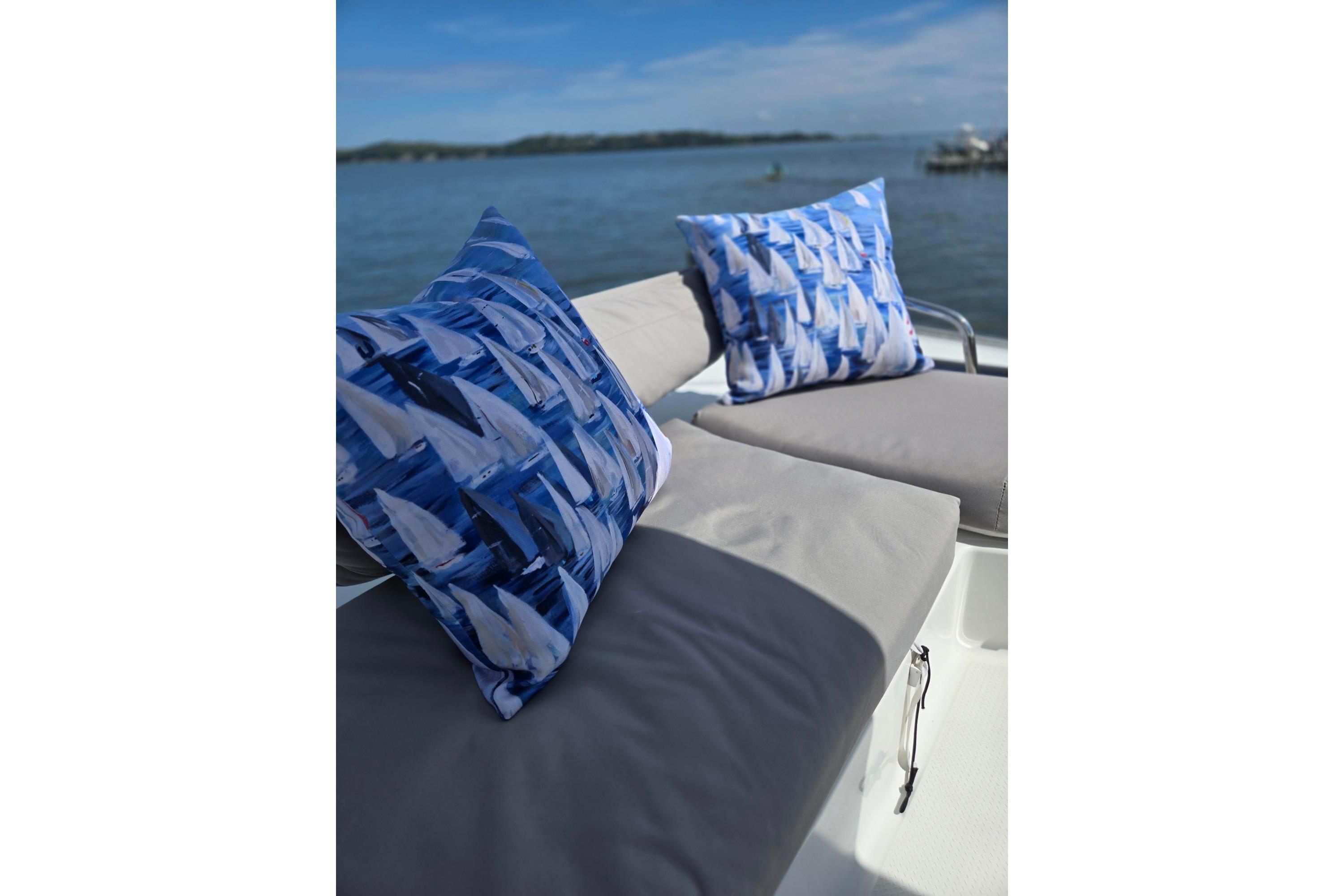 Luxurious seating on 2018 Fountaine Pajot Helia 44 Evolution catamaran with nautical-themed cushions.
