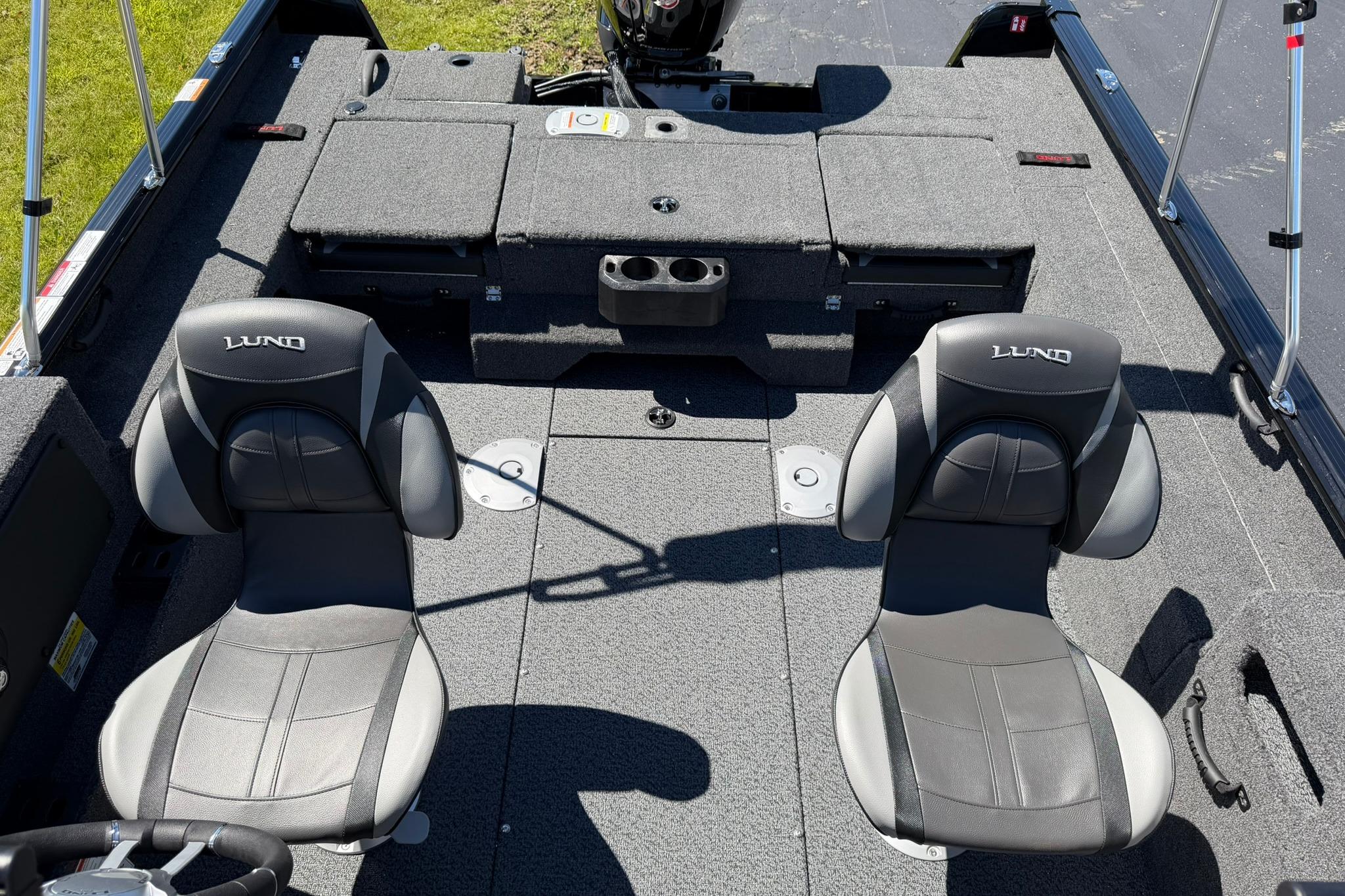 2027 Lund 1775 Impact XS Sport boat interior with two cushioned seats and storage compartments.
