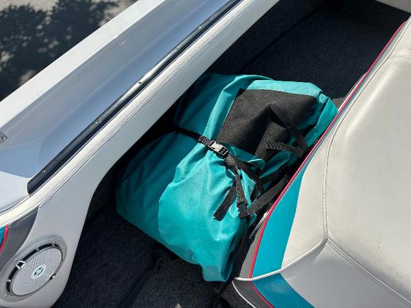 1992 Correct Craft Ski Nautique interior with teal bag and speaker.