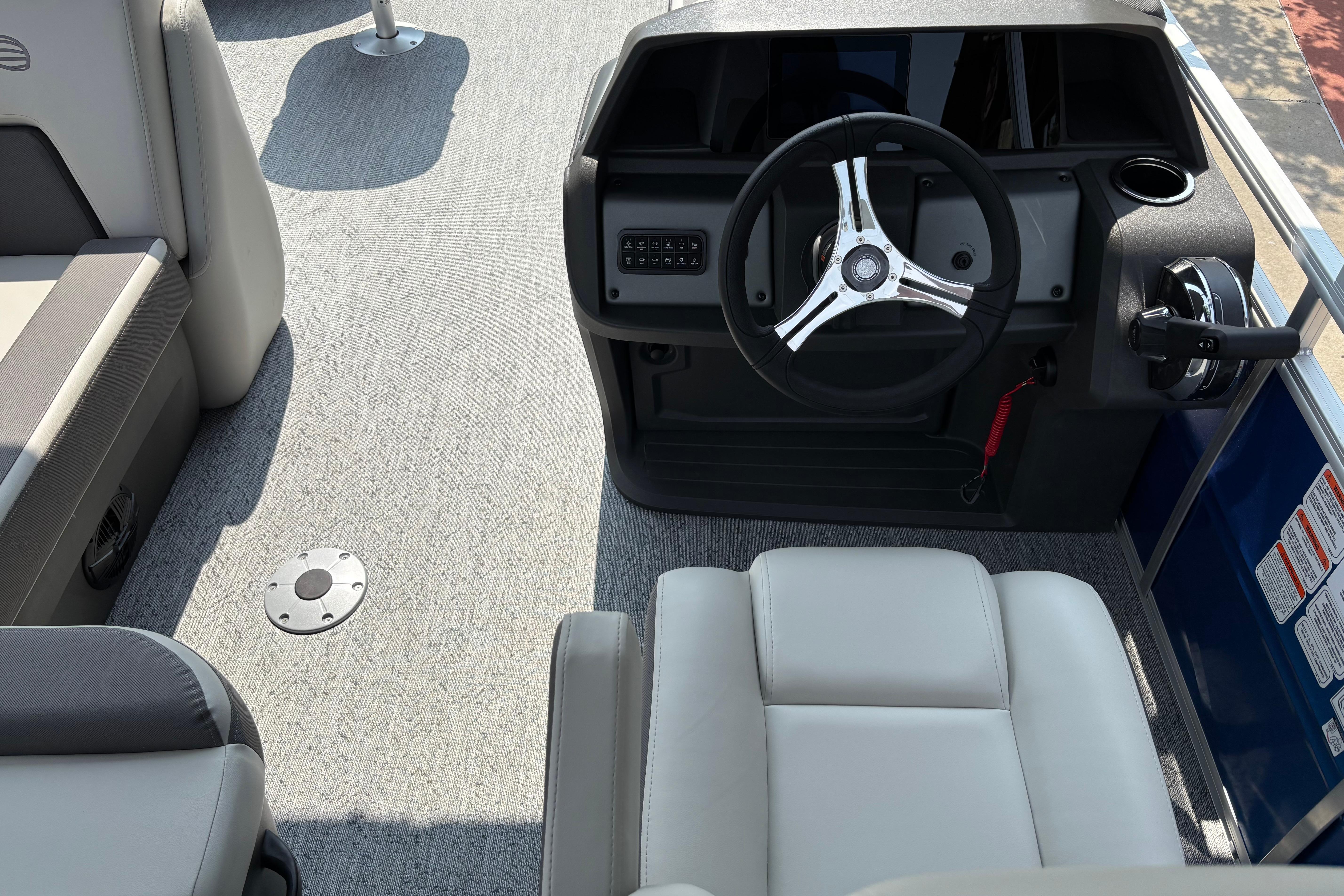 Interior view of 2026 Sun Tracker Fishin' Barge 20 DLX boat cockpit.