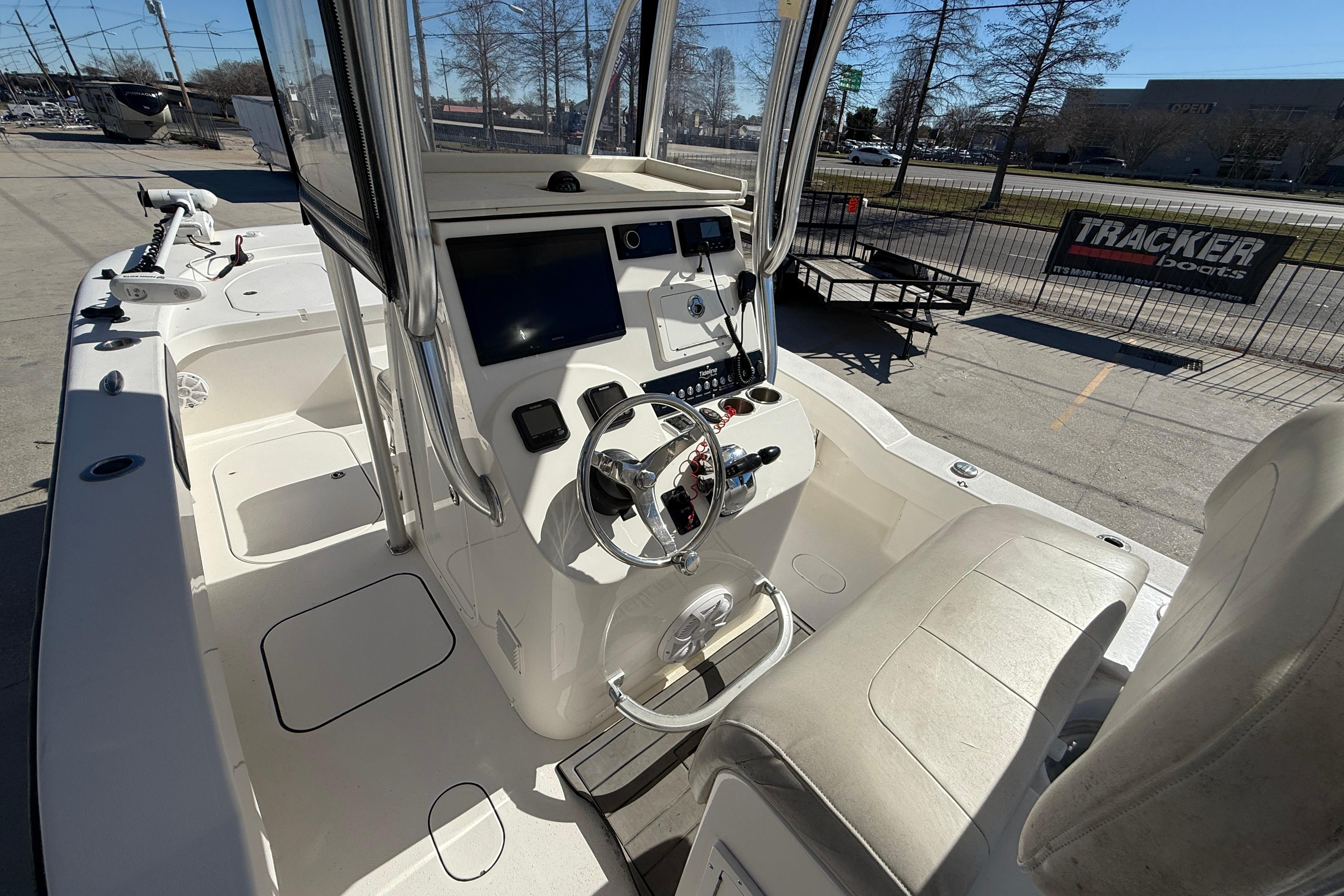 2020 Tideline 235 Hybrid boat interior with steering console and seating.
