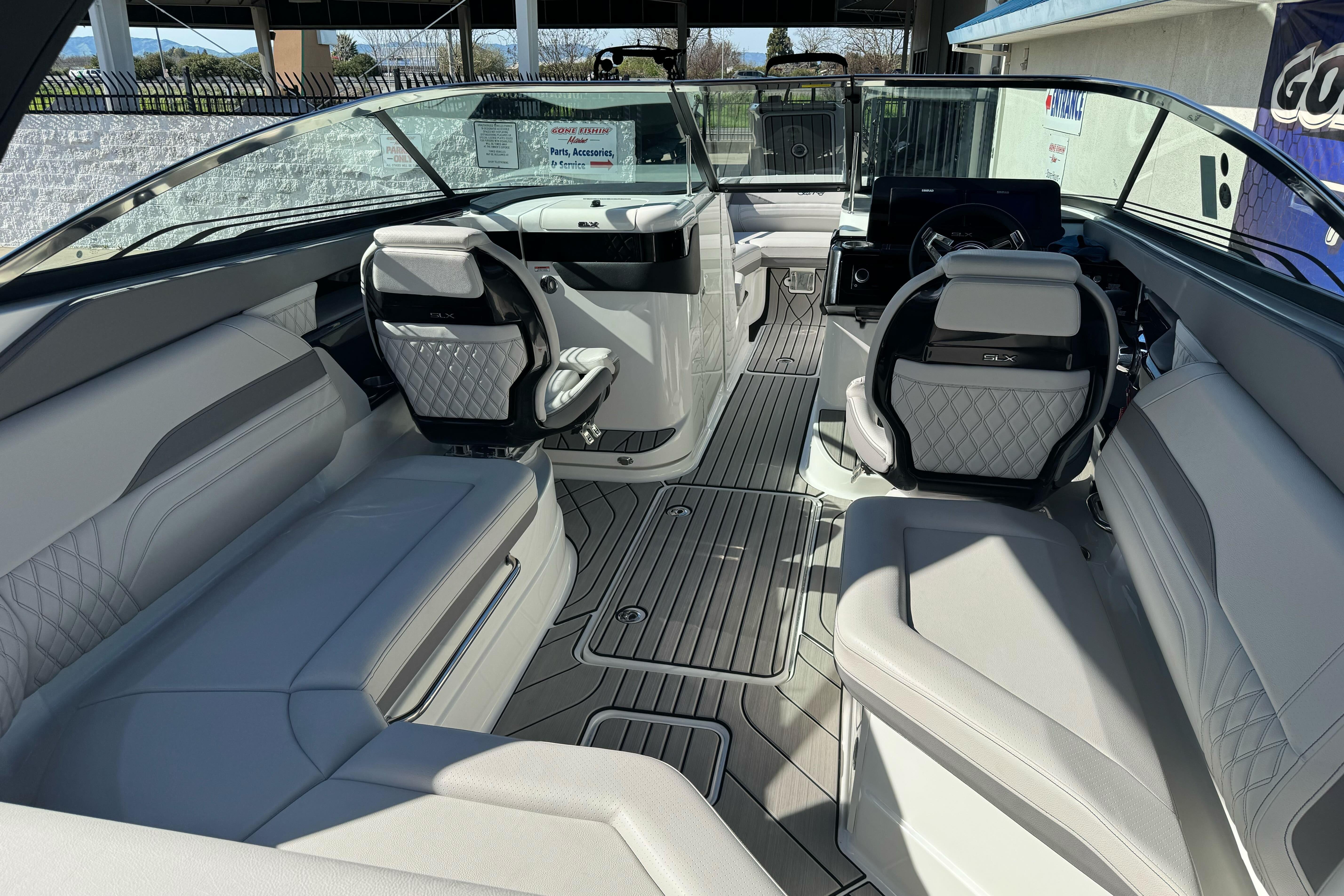 2026 Sea Ray SLX 260 boat interior with luxurious seating and modern dashboard design.