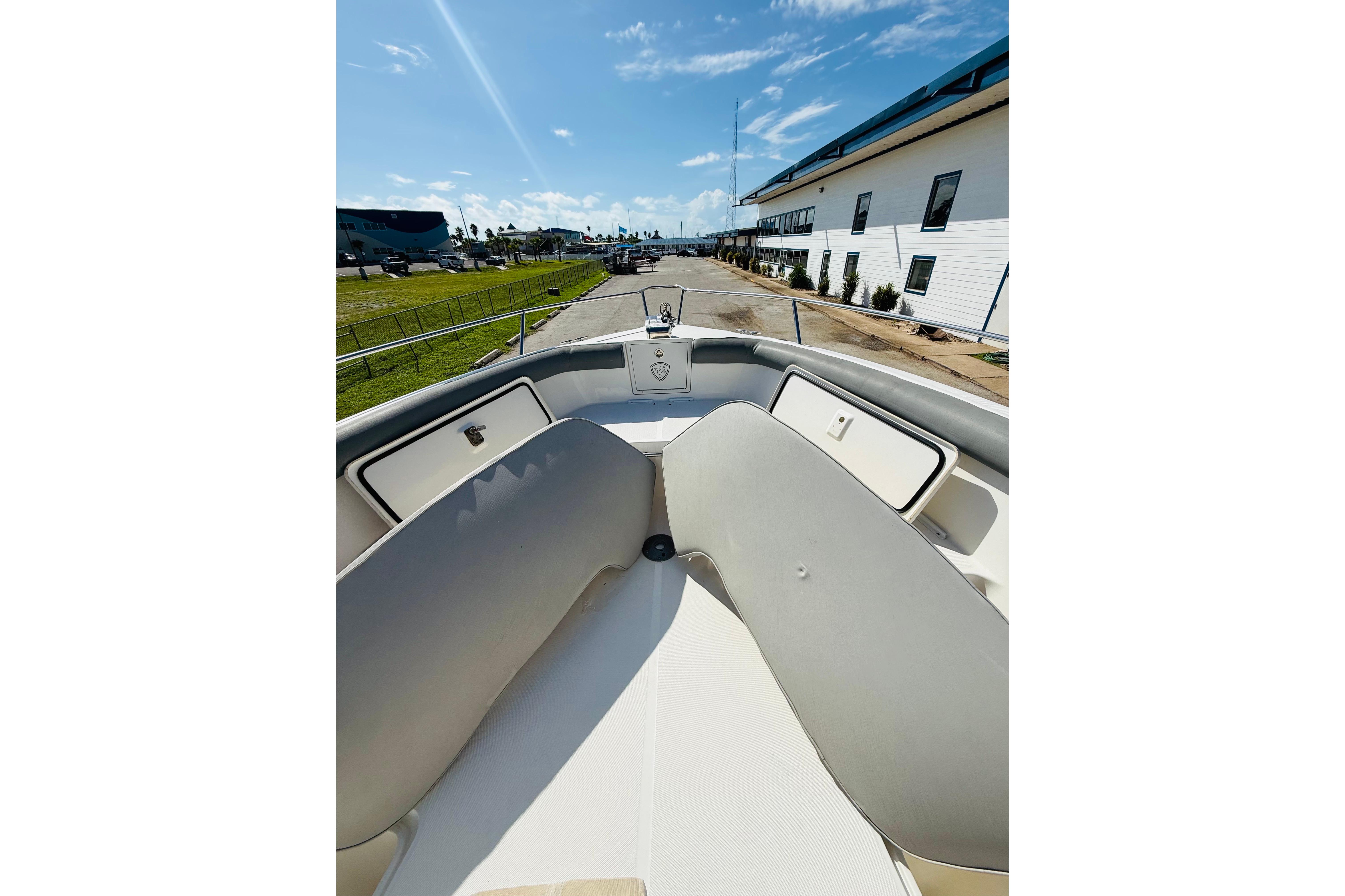 2005 Century 3200 Center Console boat interior with seating and storage compartments.
