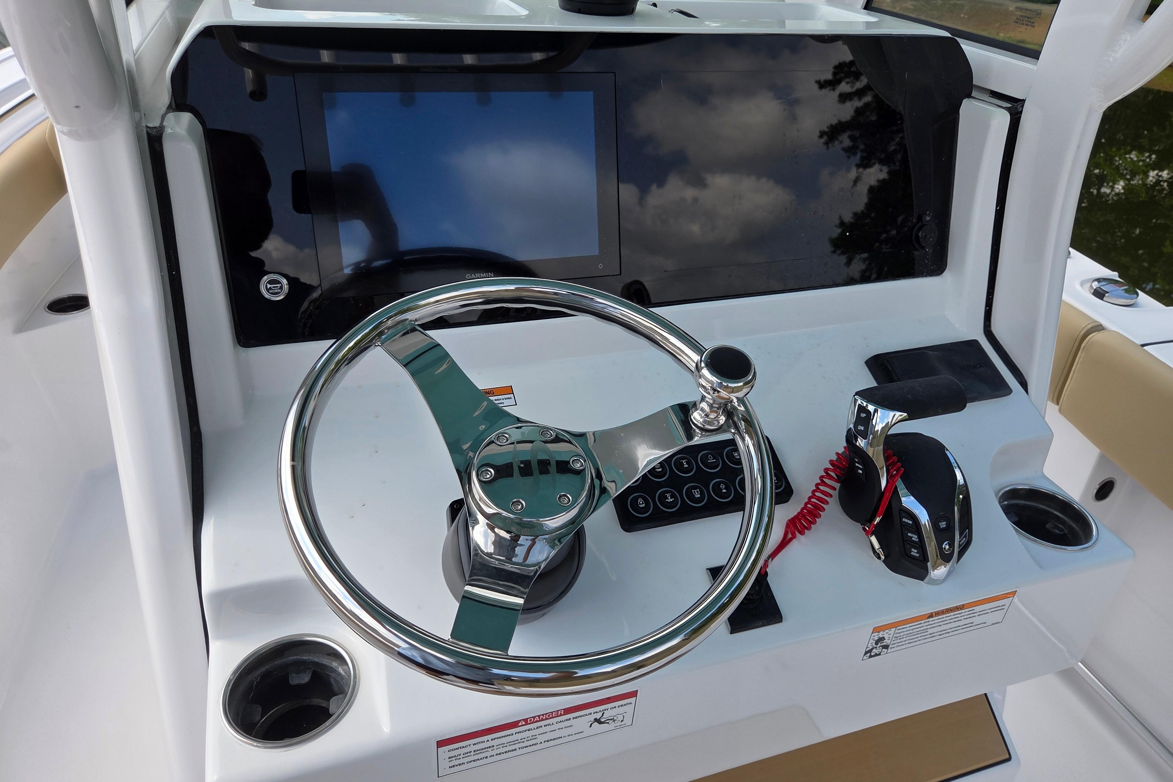 2026 Sportsman Open 232 Center Console dashboard with steering wheel and controls.