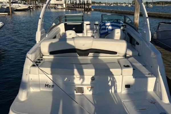 2022 Four Winns HD3 OB RS boat docked at marina, rear view.