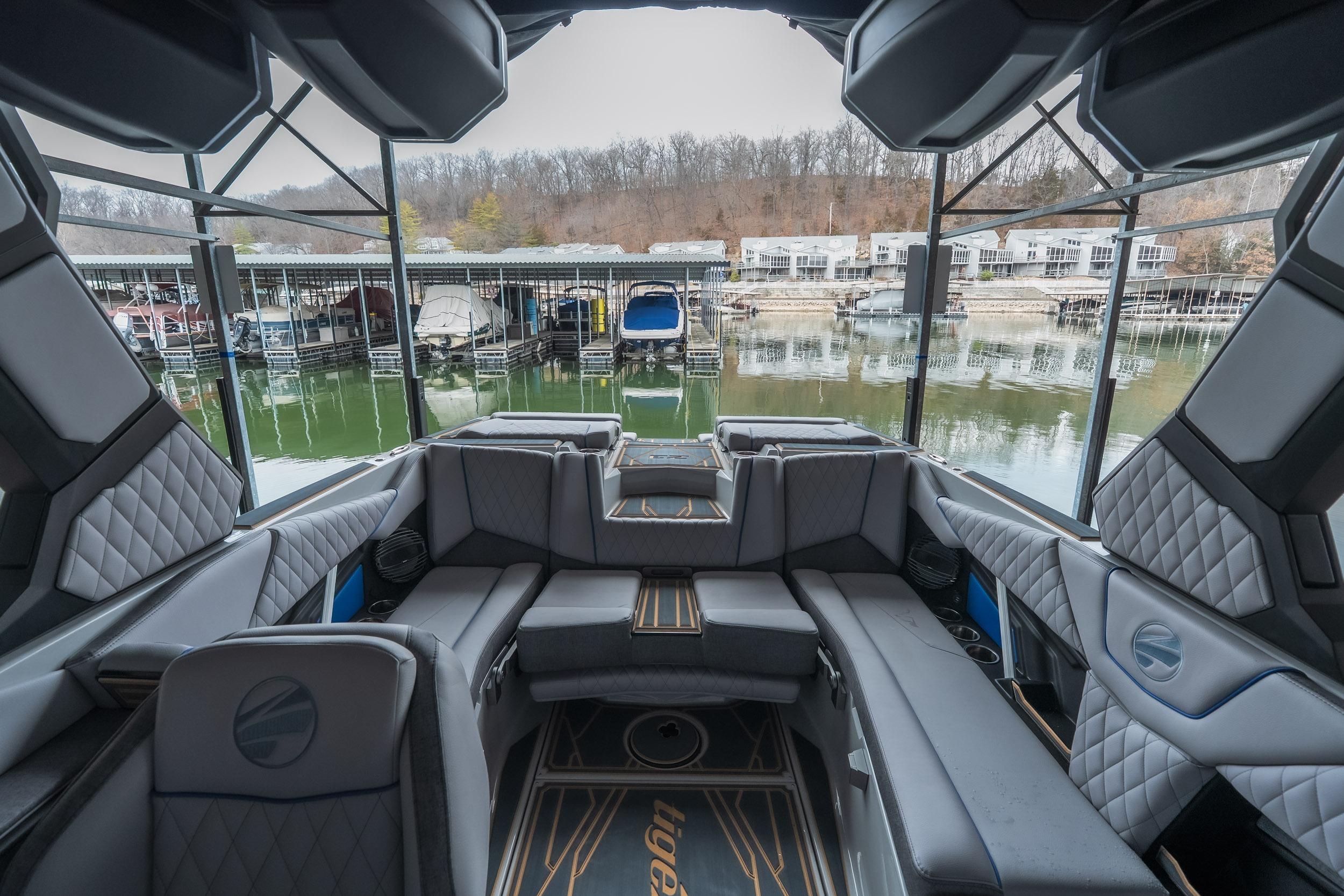 2026 Tigé Z3 boat interior with luxurious seating, docked at a marina.