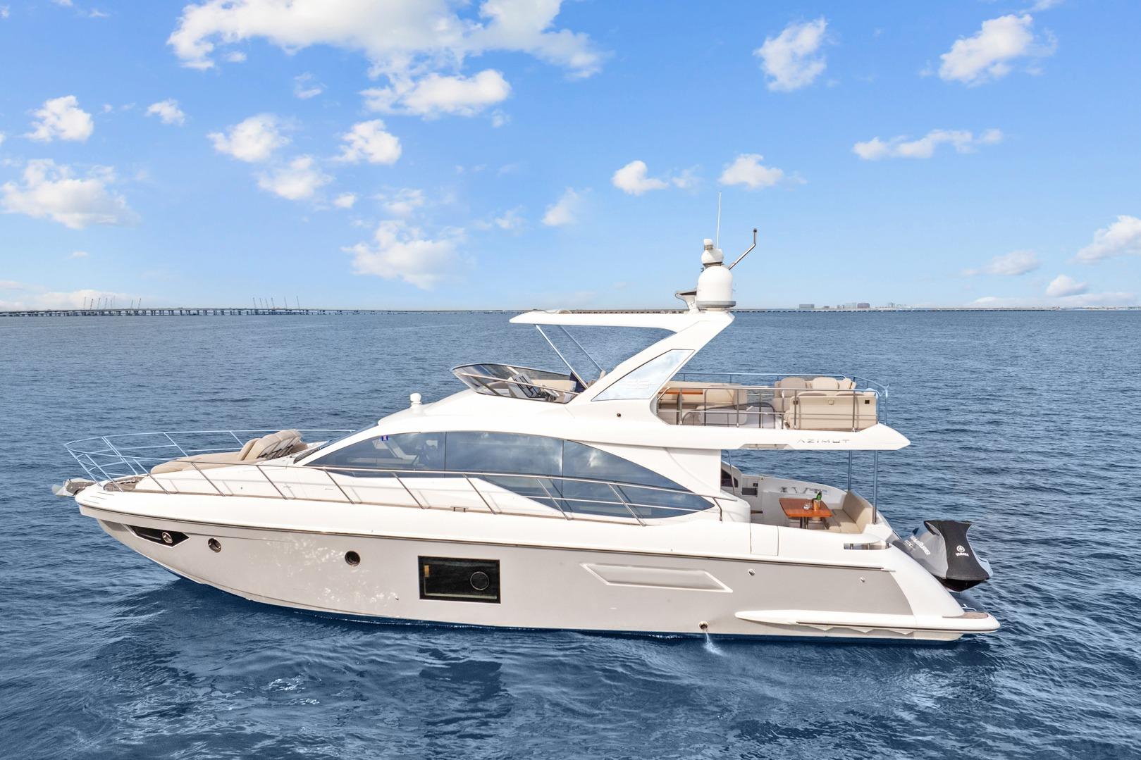 2019 Azimut 55 yacht cruising on open water under a clear blue sky.