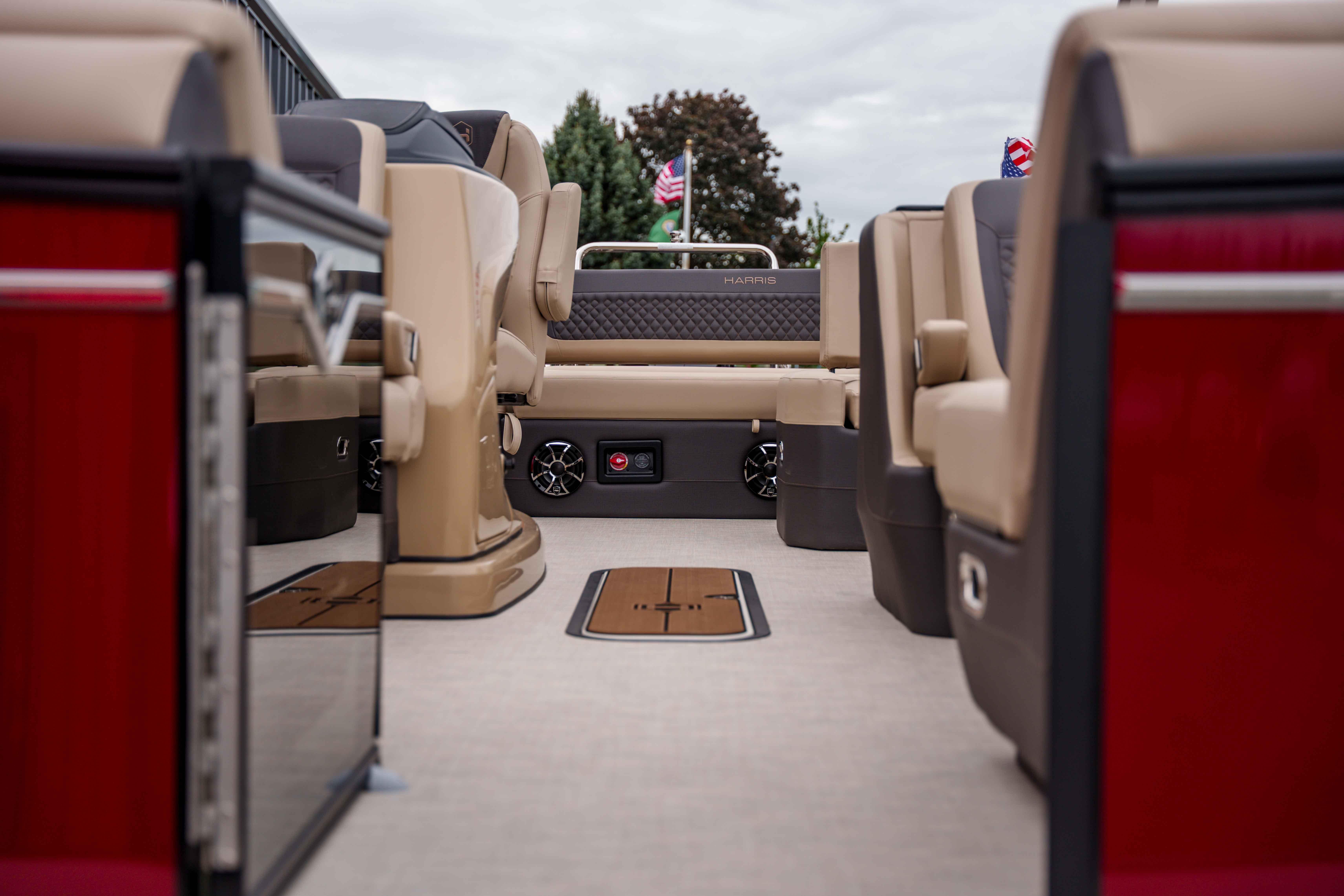 2026 Harris Sunliner 230 interior with beige seating and modern design elements.