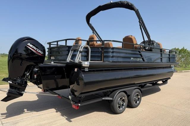 2026 Ranger 223F pontoon boat with Mercury engine on a trailer, parked outdoors.