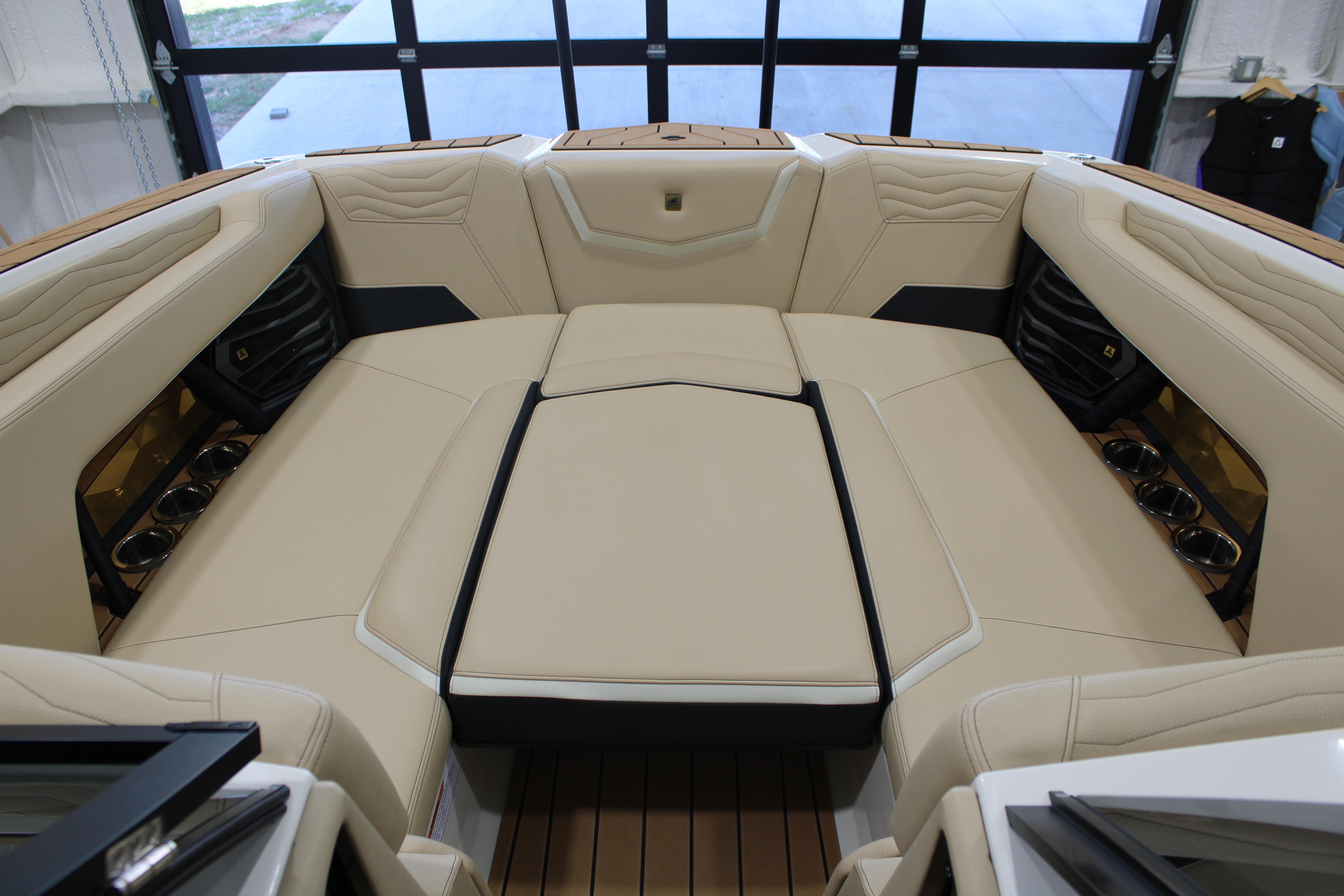 Luxurious interior of 2025 Nautique Super Air Nautique G25 boat with beige seating.