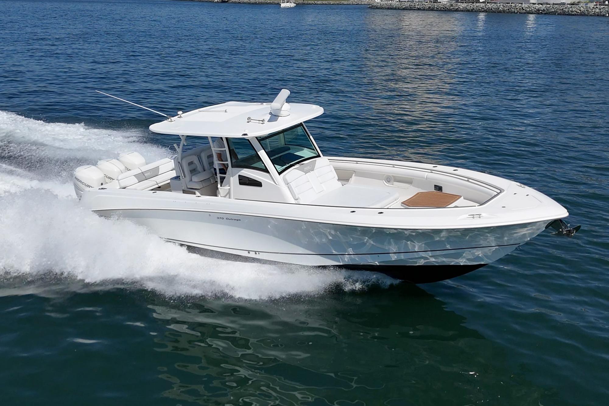 2015 Boston Whaler 370 Outrage cruising on open water, showcasing sleek design and performance.
