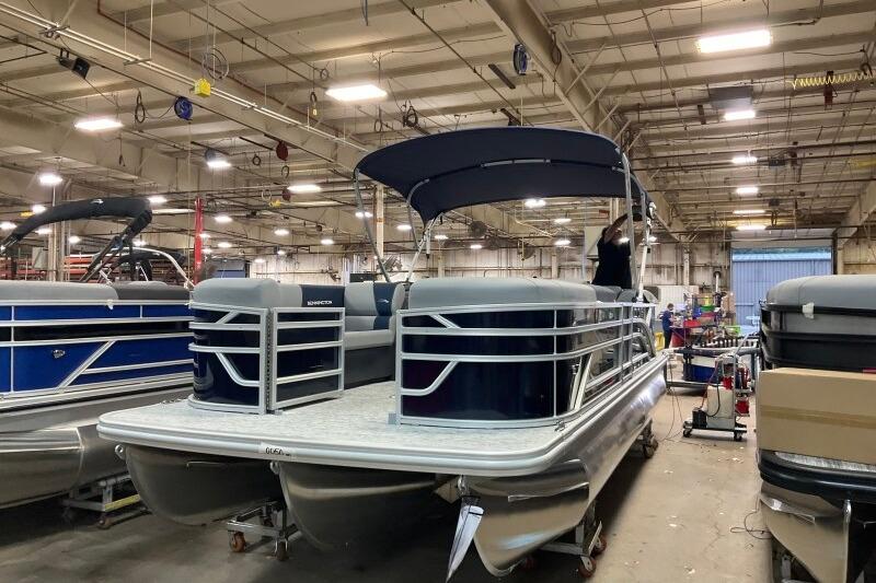 2026 Bennington 23 SSRSF pontoon boat in a factory setting.
