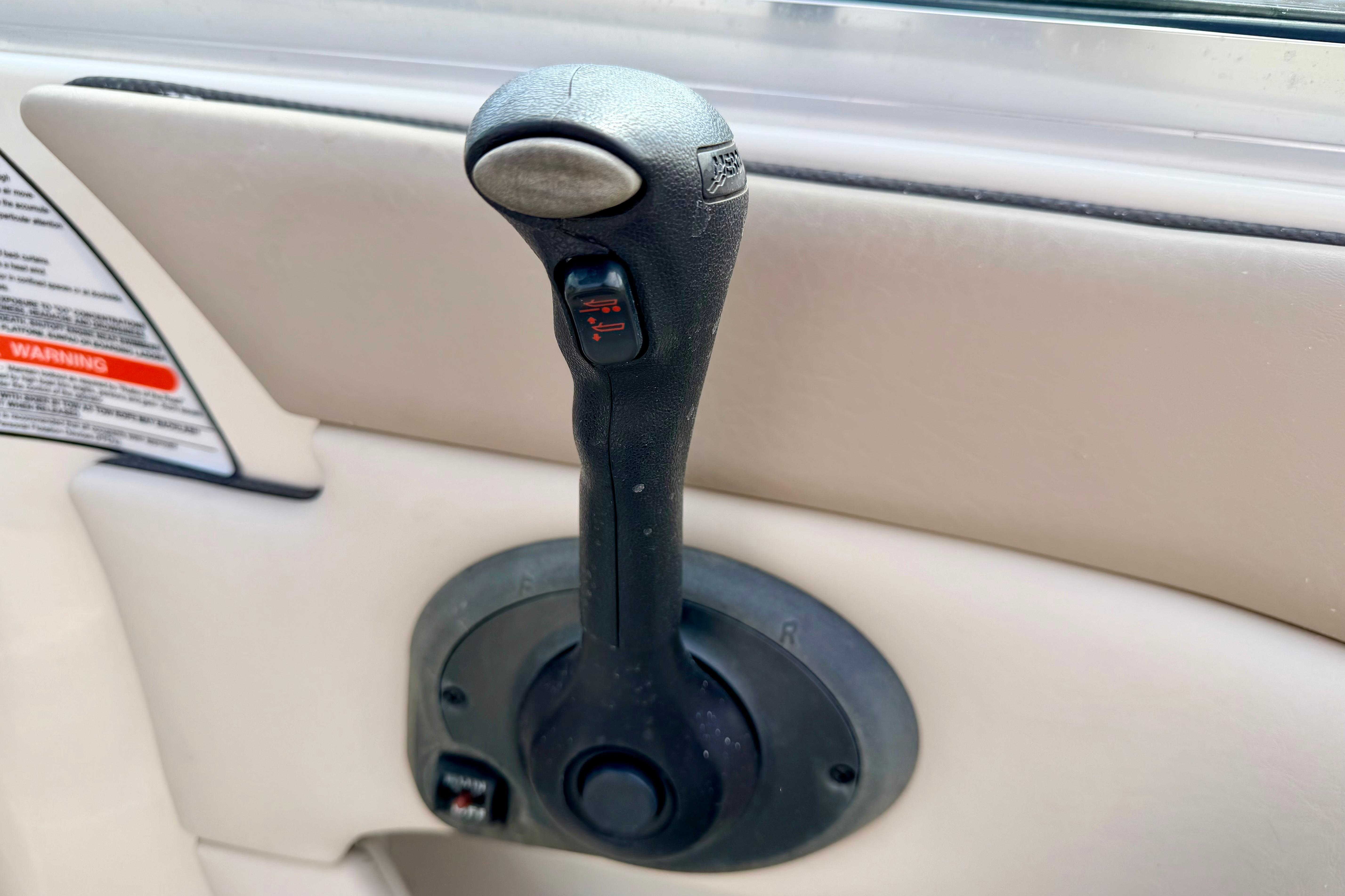 Throttle control lever on a 2003 Sea Ray 200 Sundeck boat.