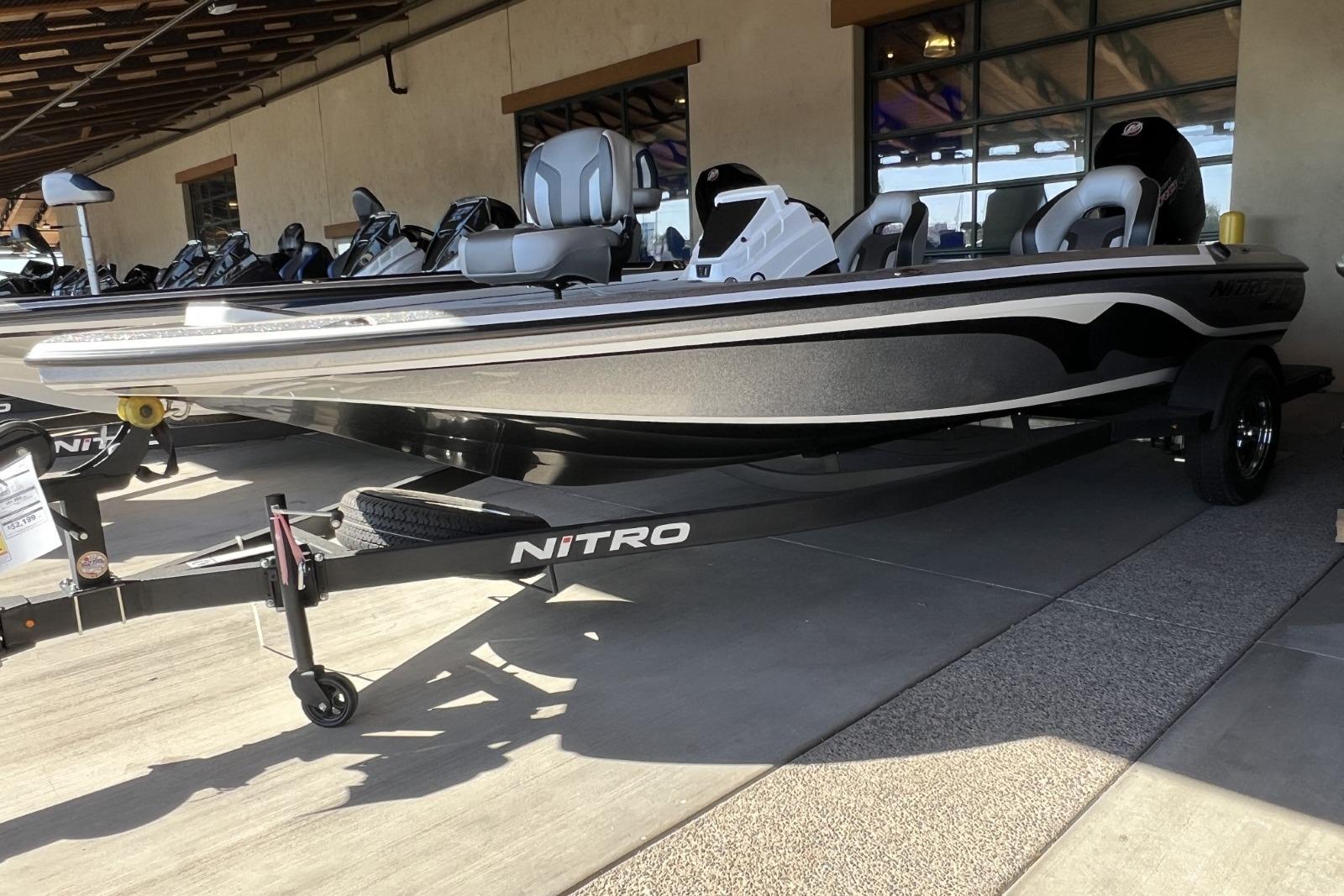 2025 Nitro Z19 boat on trailer, displayed outdoors, showcasing sleek design and modern features.