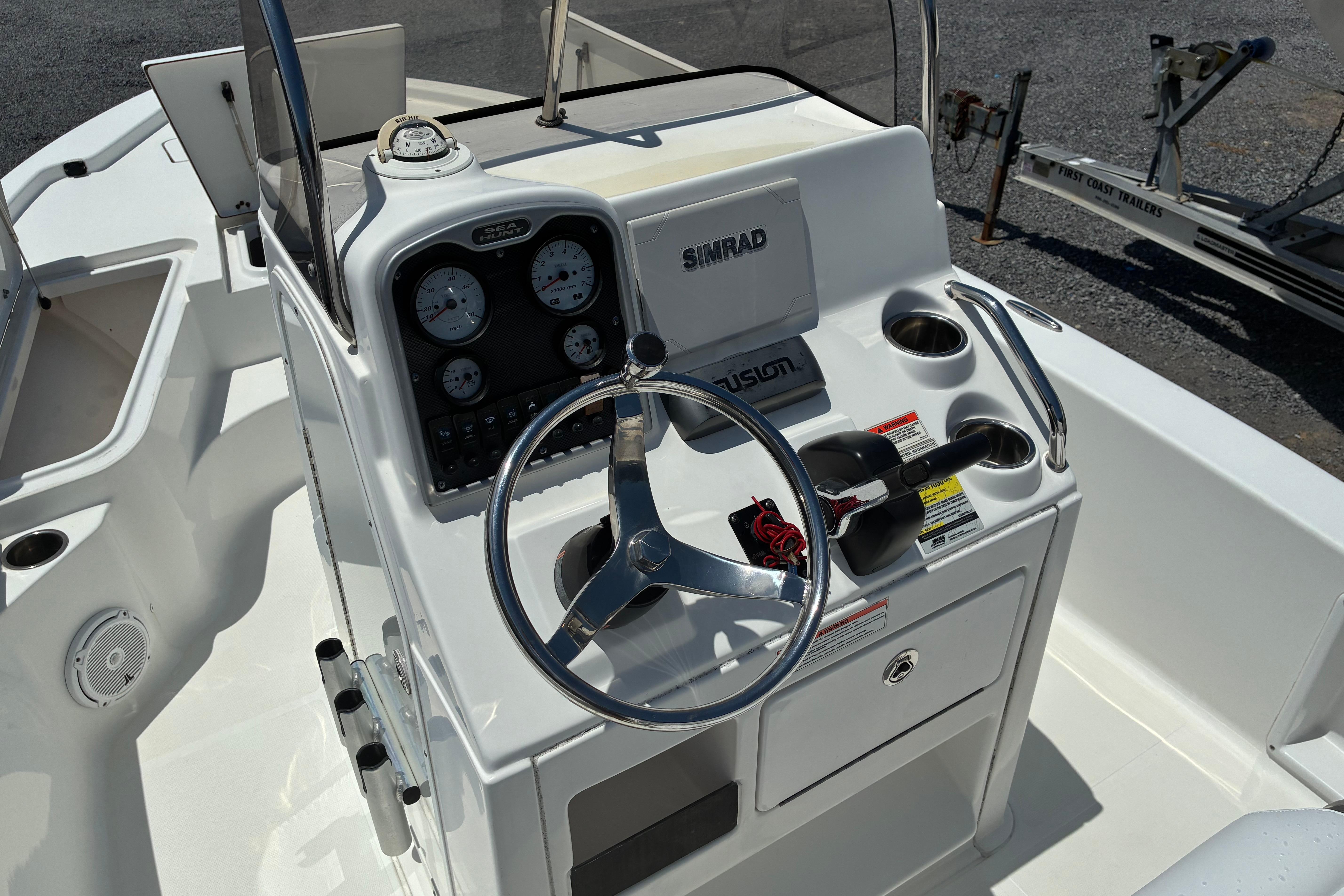 2014 Sea Hunt BX 20 BR boat console with steering wheel and navigation equipment.