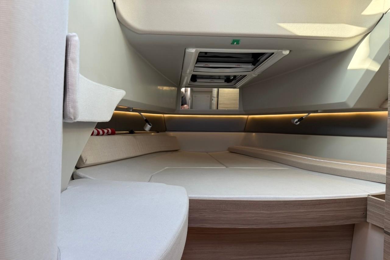 Interior cabin of 2024 Saxdor 320 GTC boat, featuring modern design and ambient lighting.