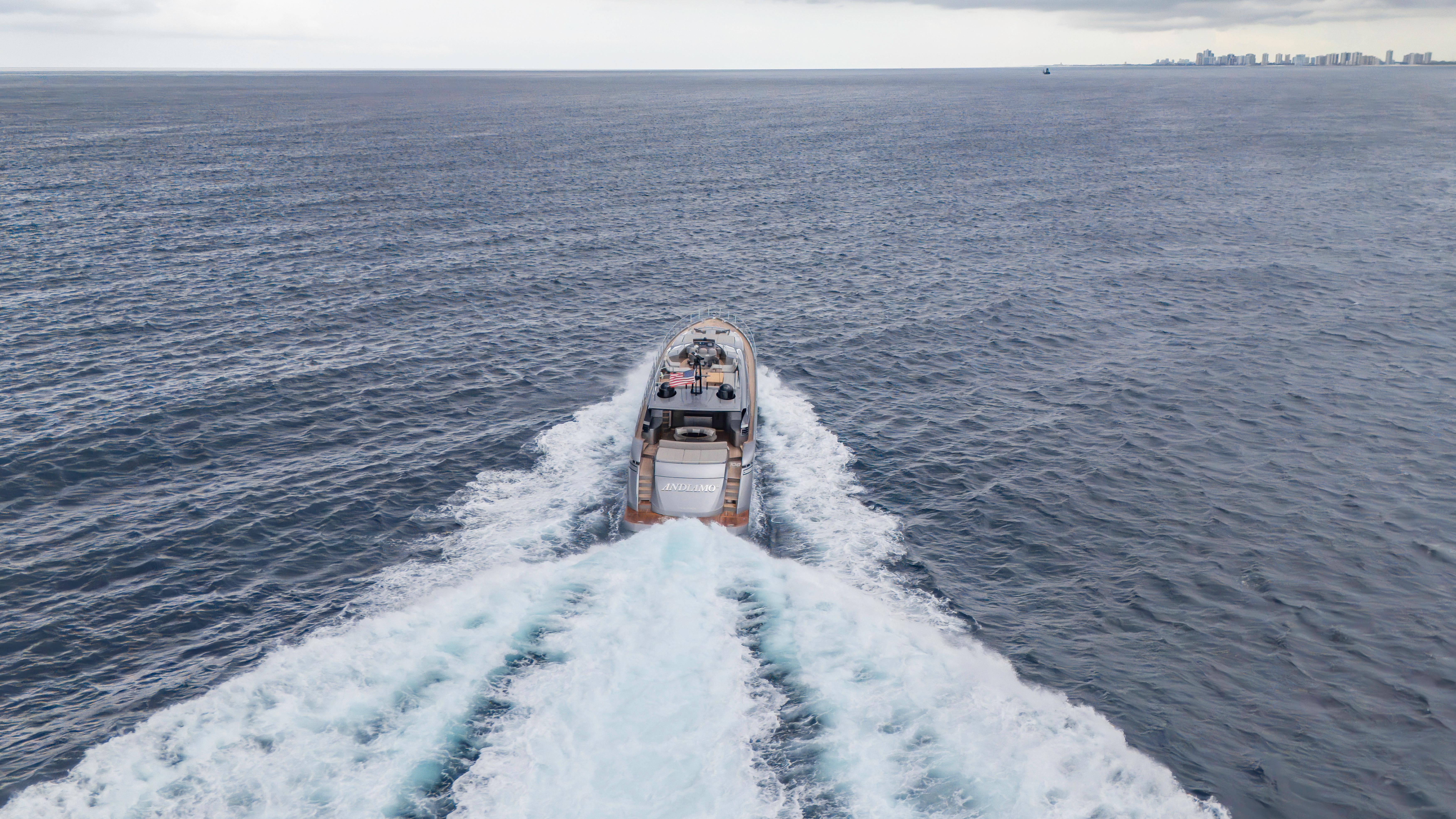 Aerial view of 2021 Pershing 108 yacht cruising on open sea.
