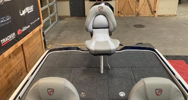 2025 Triton 20XP boat interior with gray seating in a garage setting.