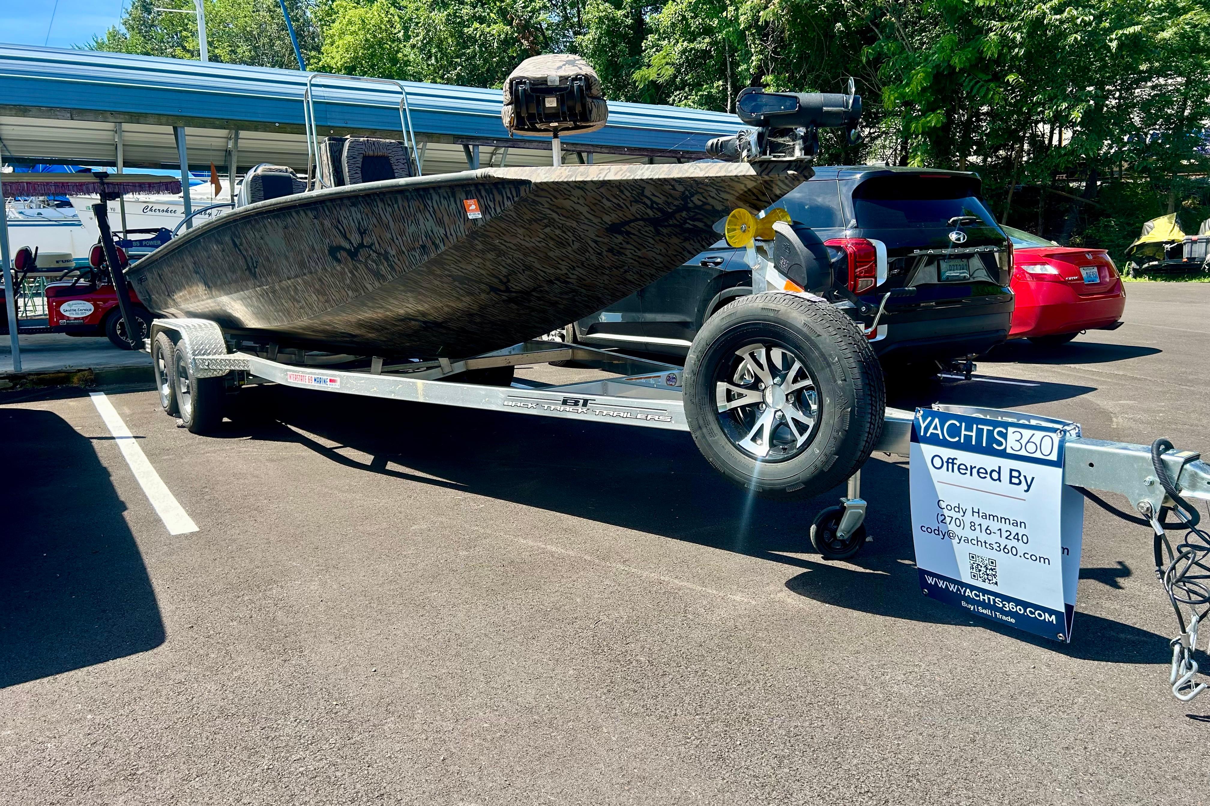 2025 Xpress H22B Bay boat on trailer in parking lot, offered by Yachts360.