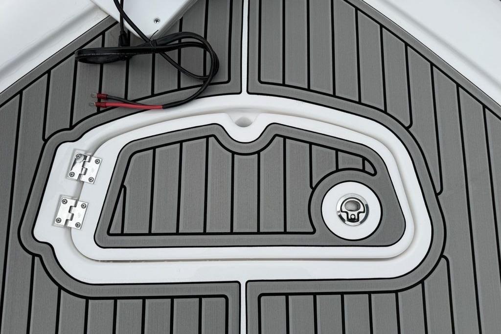 Deck detail of 2026 Tidewater 2500 Carolina Bay boat with wiring and hatch.
