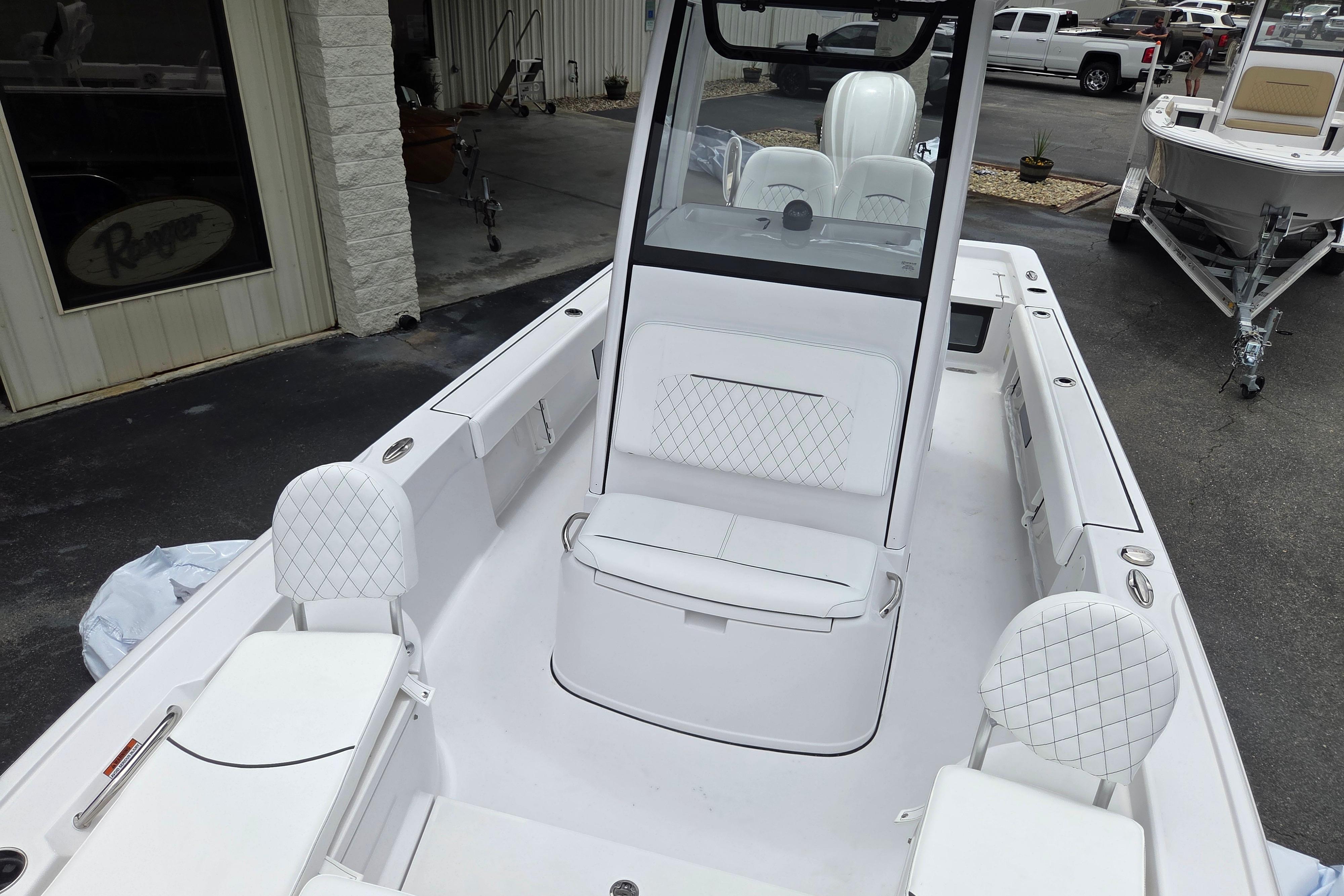2026 Sportsman Masters 247 Bay Boat interior with white seating and console.