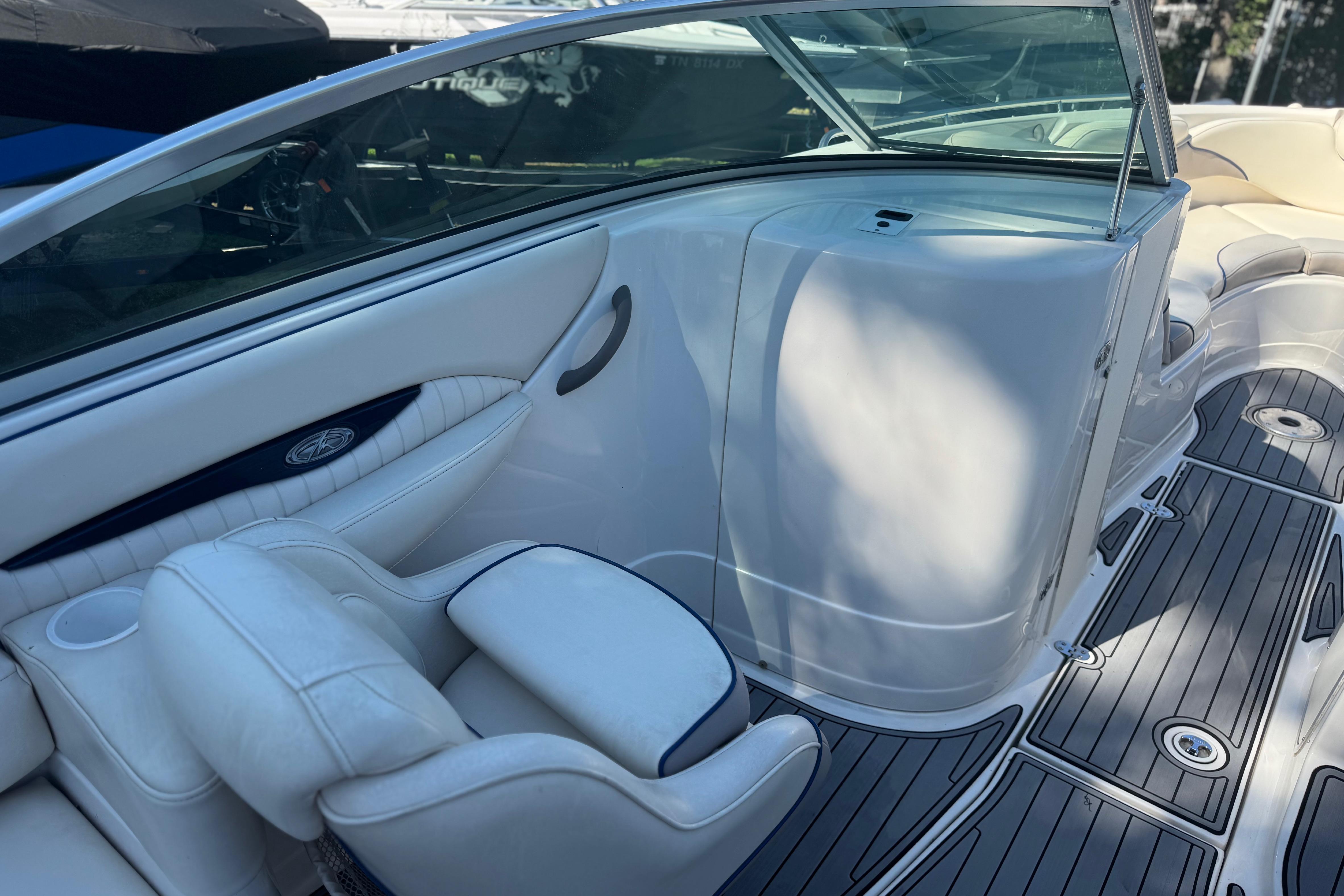 Interior view of a Monterey 268SS Super Sport boat with white seating and sleek design.