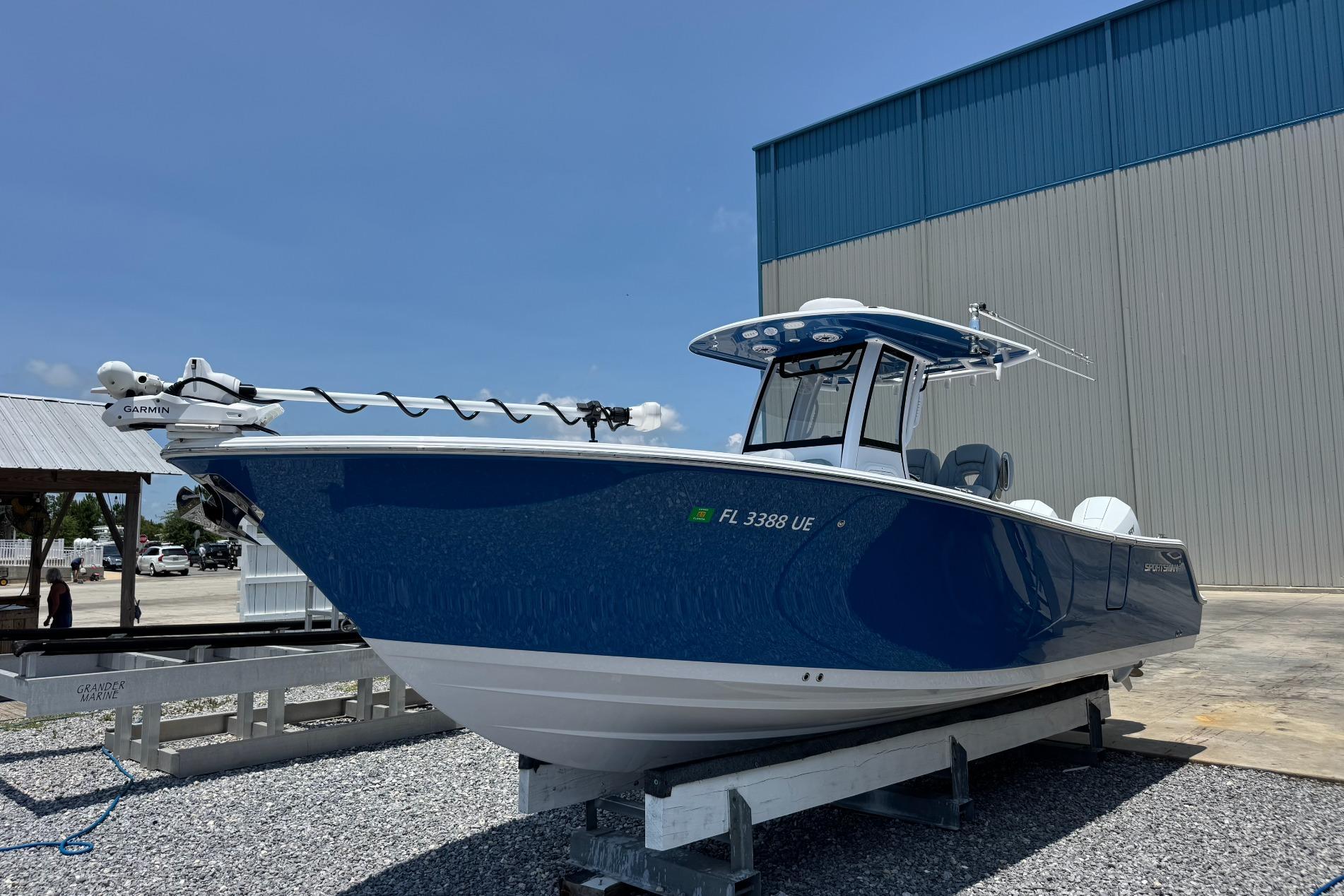 2026 Sportsman Open 262 Center Console boat in blue, docked outdoors.
