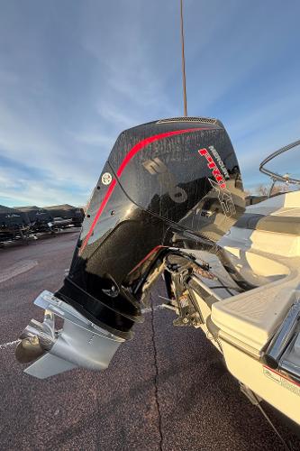 2024 Tahoe T21 boat with powerful outboard motor in a sunny setting.