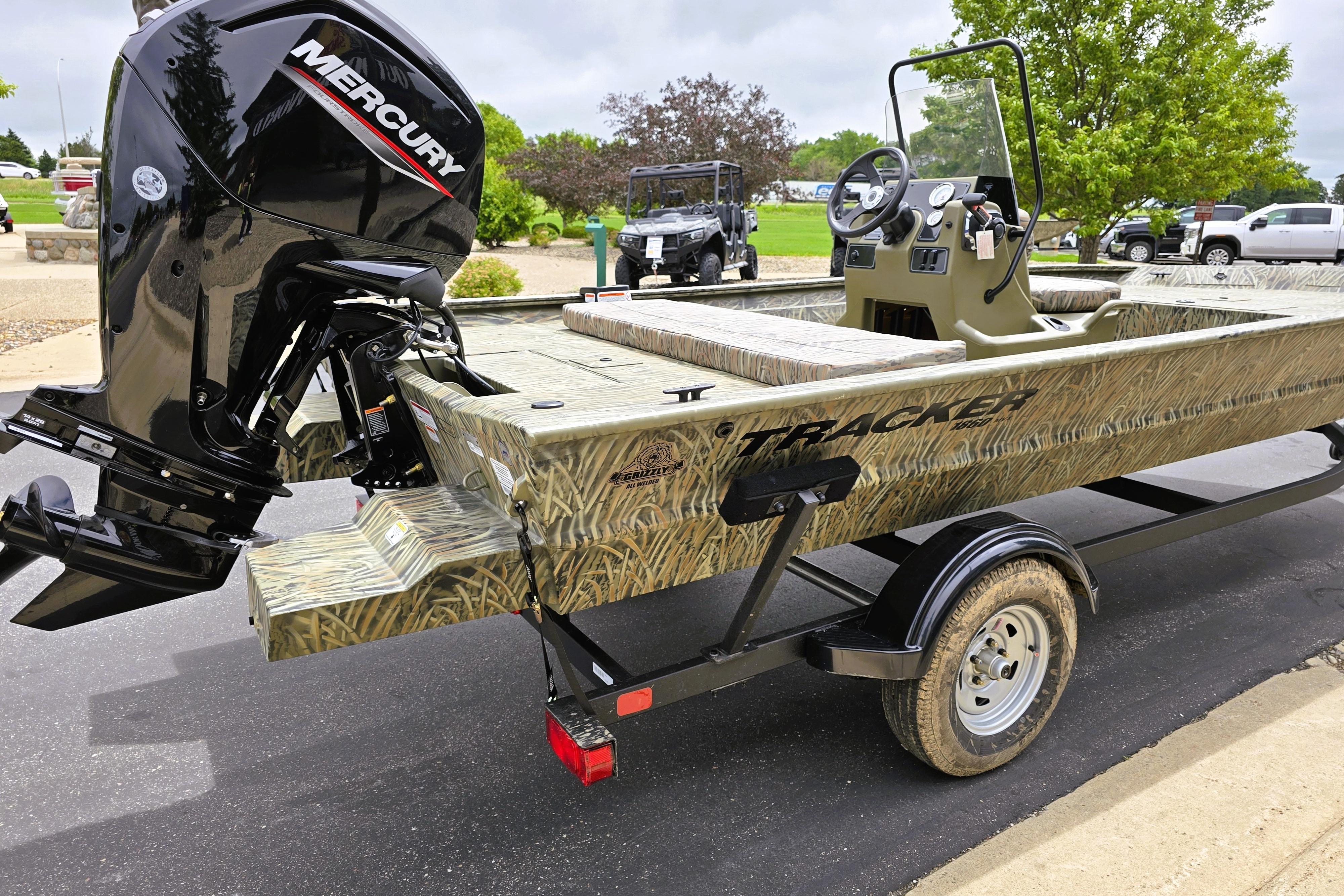 2026 Tracker Grizzly 1860 CC boat with Mercury engine on trailer.