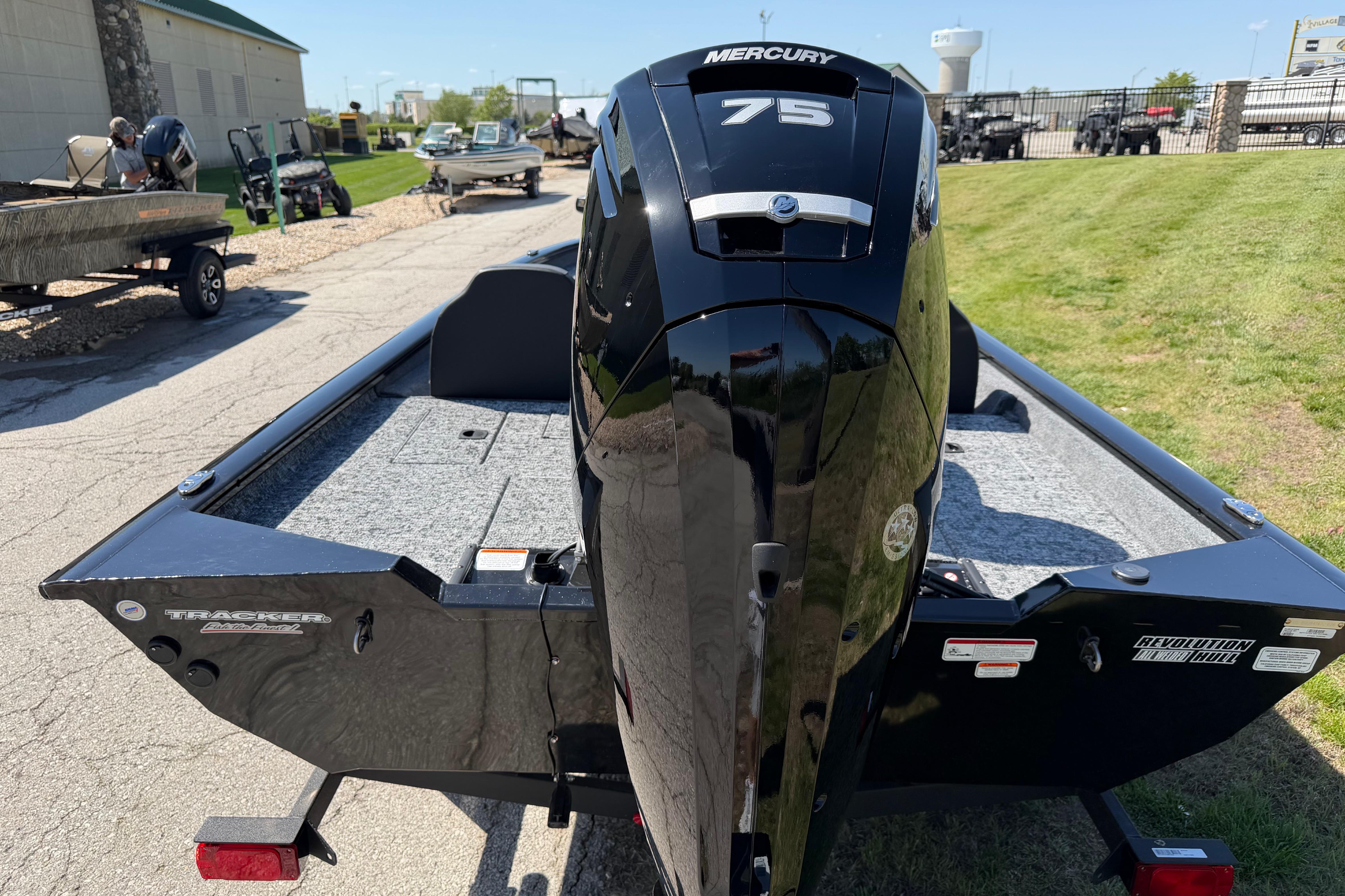 2026 Tracker Pro Team 175 boat with Mercury 75 engine, parked outdoors.