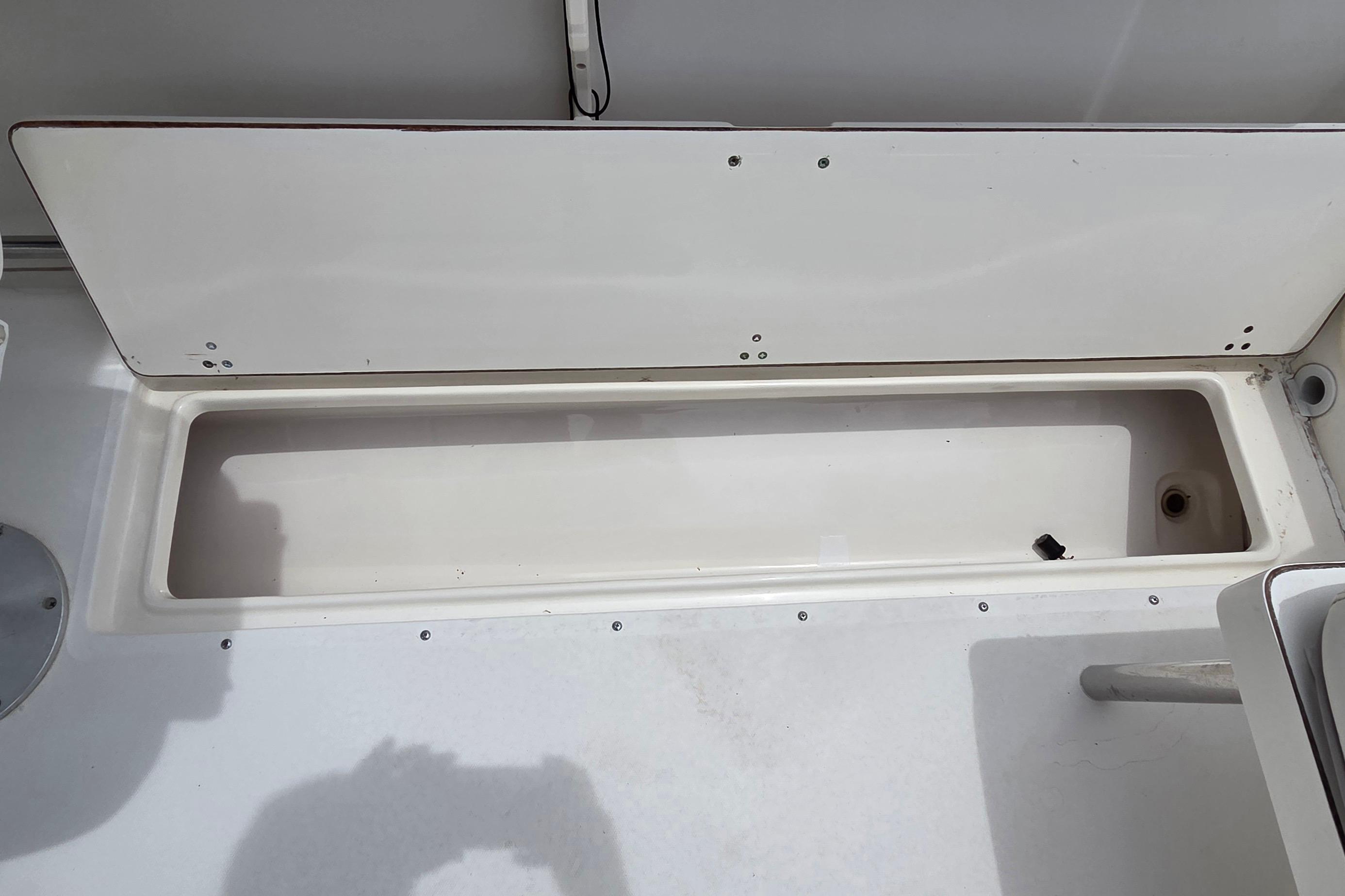 Open storage compartment on a 2000 Boston Whaler 21 Ventura boat.