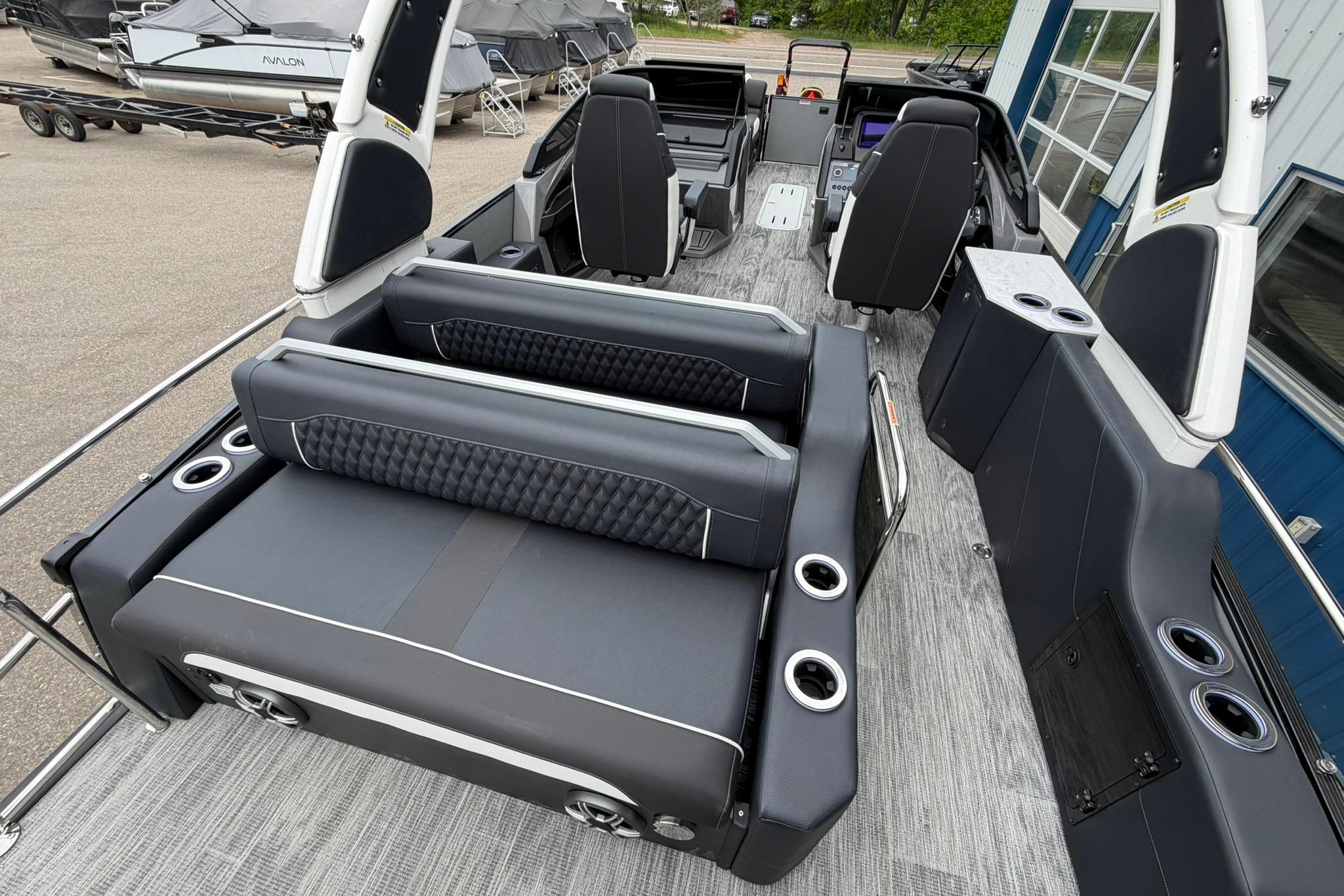 2026 Avalon Excalibur LTD Flex Lounge Windshield boat interior with luxurious seating and modern design.
