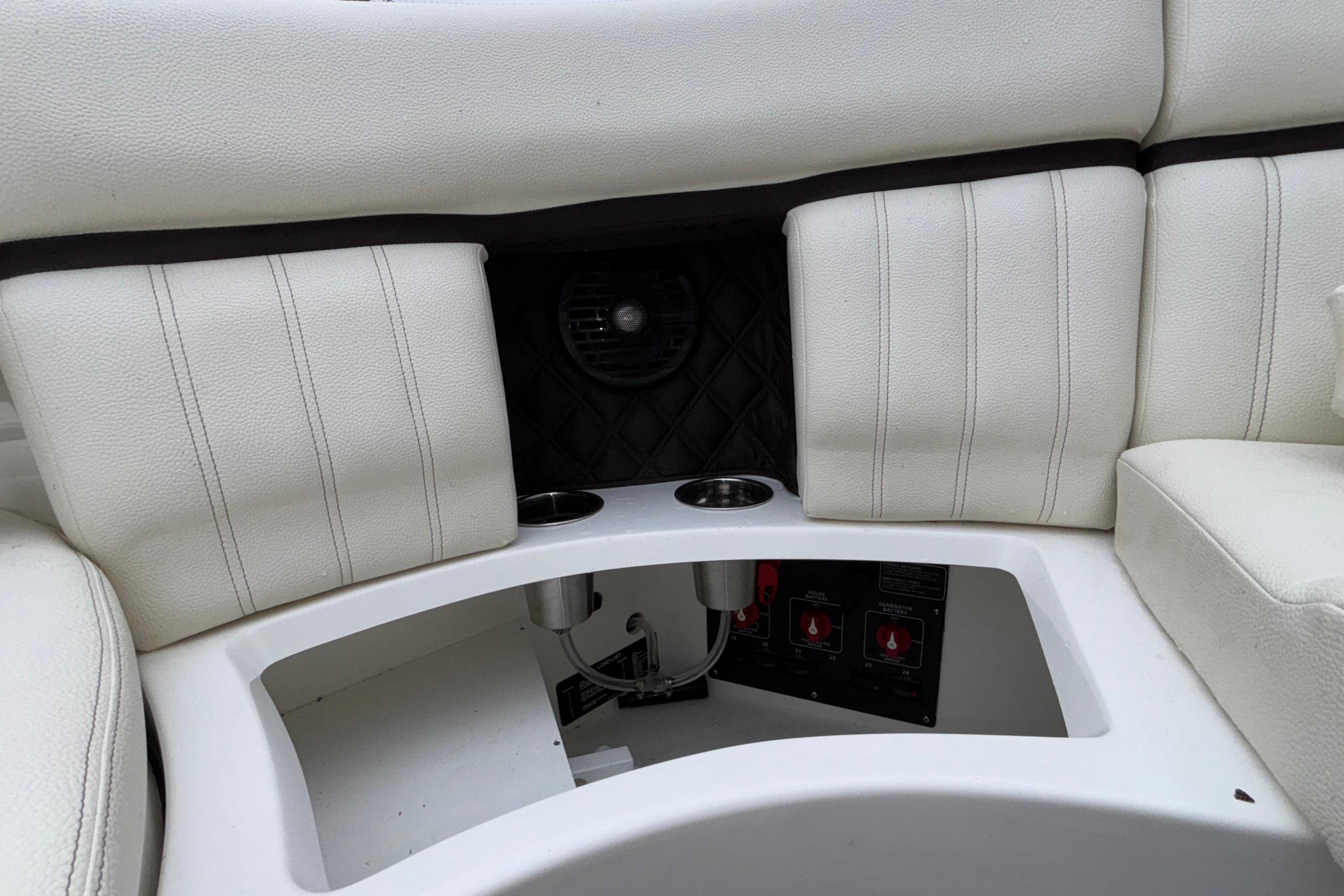 2022 Cobalt R35 boat interior with white cushioned seating and cup holders.