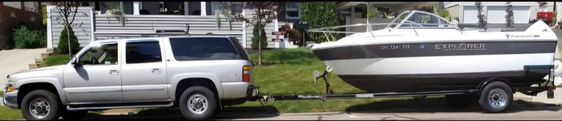 2012 Campion Explorer 542 Sport Cabin on trailer with SUV.
