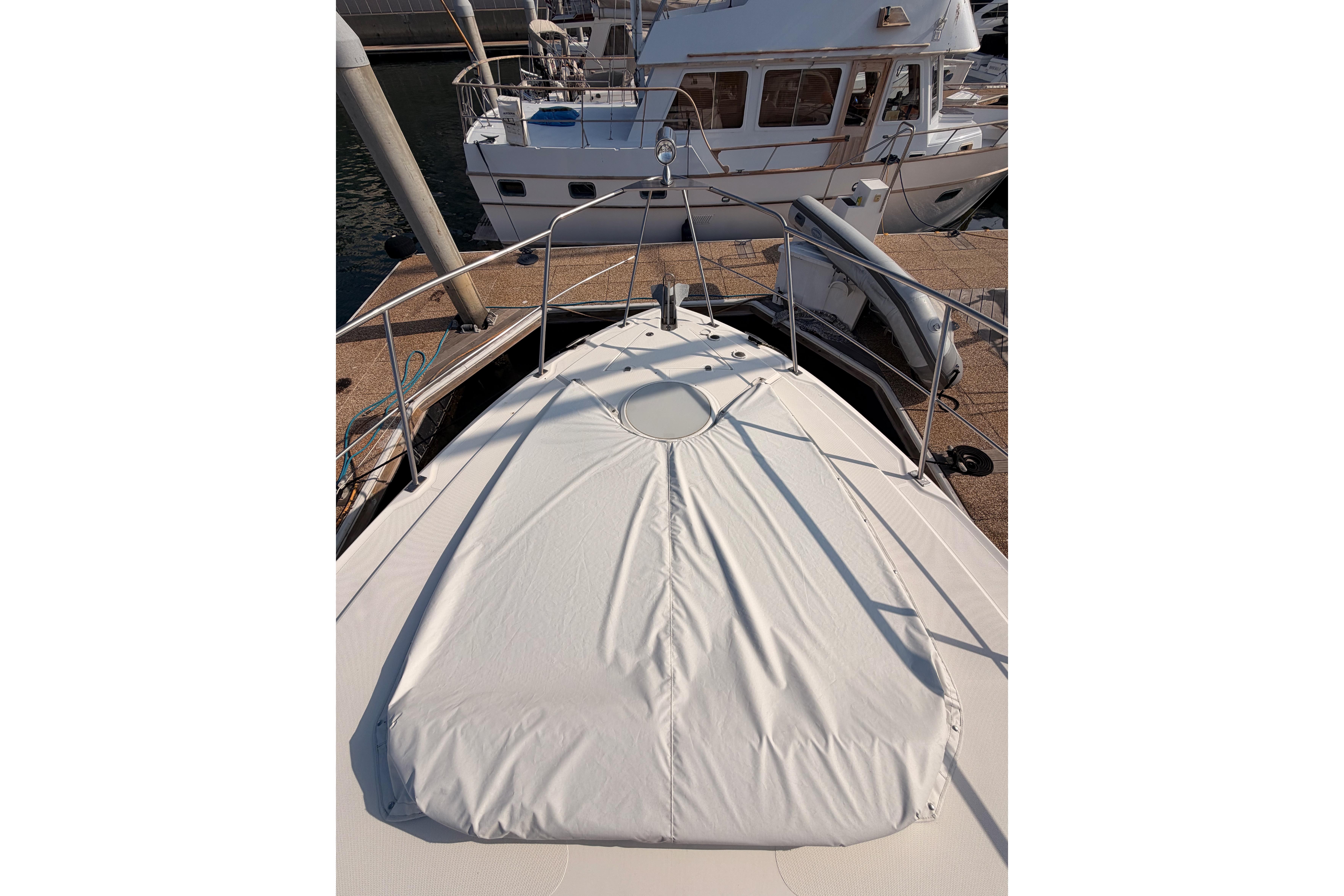 2005 Cruisers Yachts 405 Express Motoryacht bow view at marina.