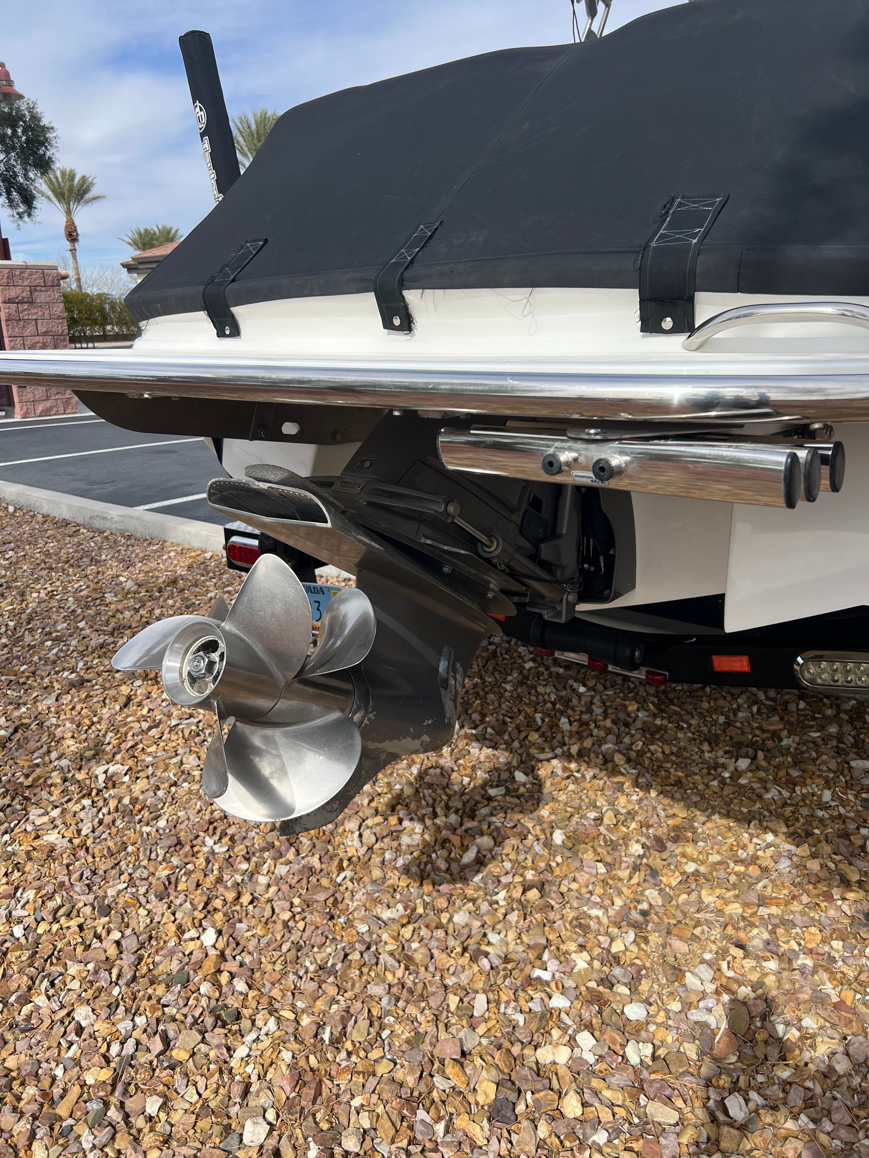 Rear view of a 2012 Cobalt 232 boat with propeller.