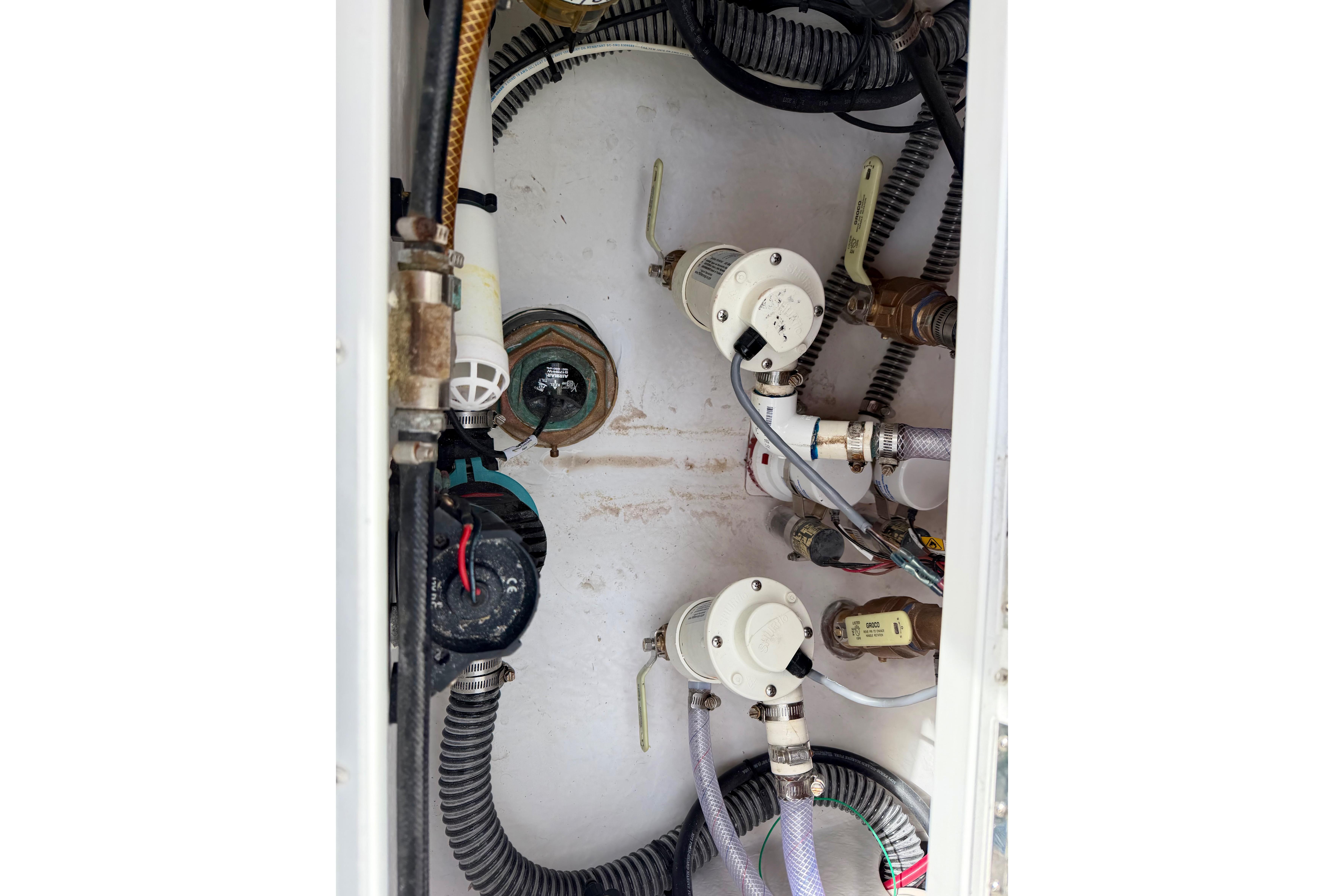 Bilge area of 2025 Ocean Master 296 Center Console with pumps and wiring.