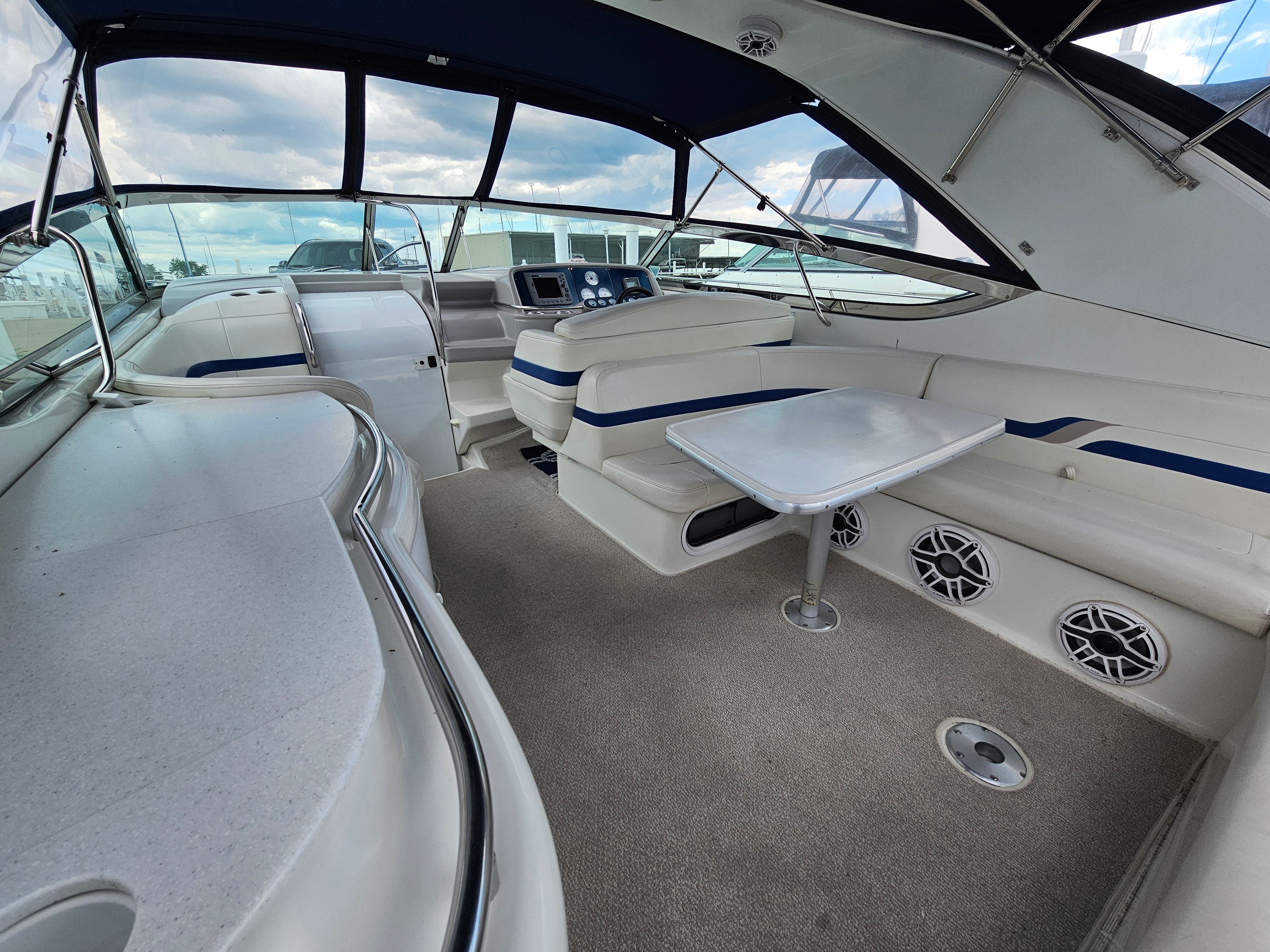Interior of a 2001 Formula 400 Super Sport with seating and a table.