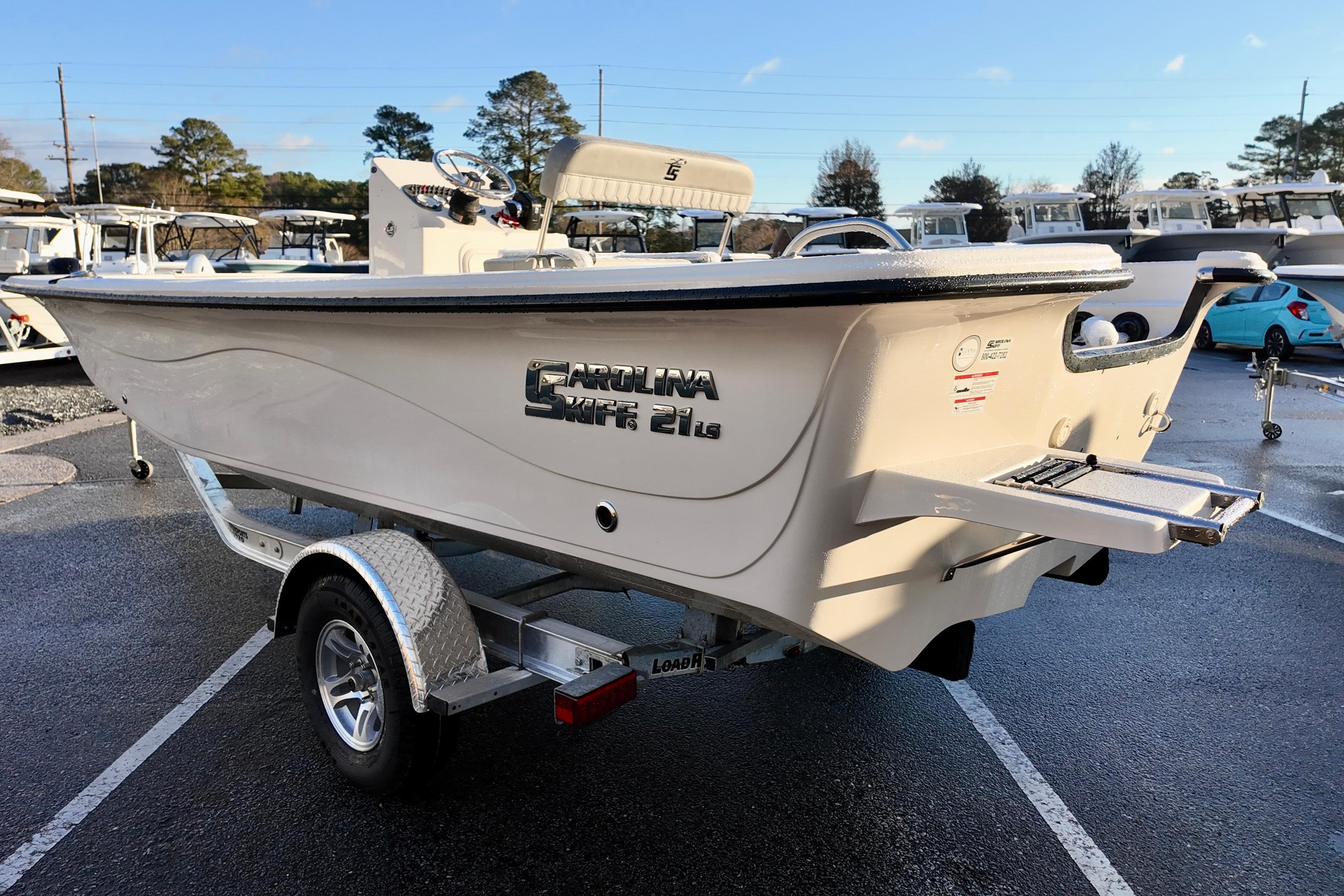2026 Carolina Skiff 21 LS boat on trailer, parked outdoors in a lot.