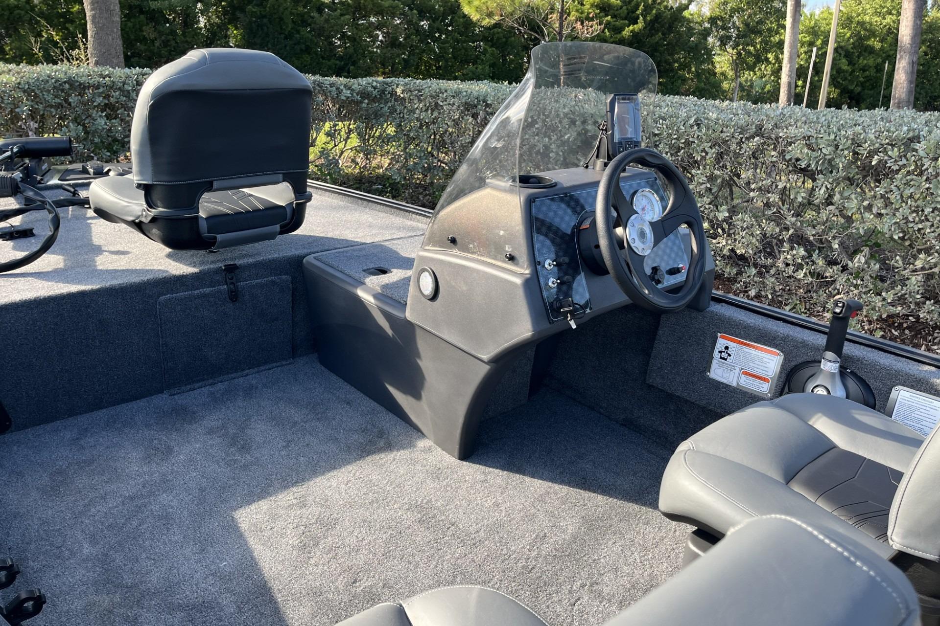 2026 Tracker Bass Tracker Classic XL boat interior with steering console and seating.