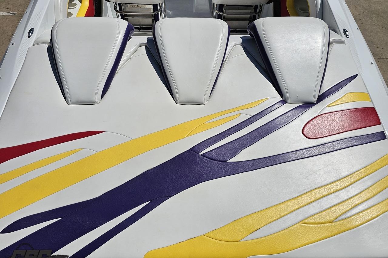2005 Baja 30 Outlaw boat interior with colorful seat design.